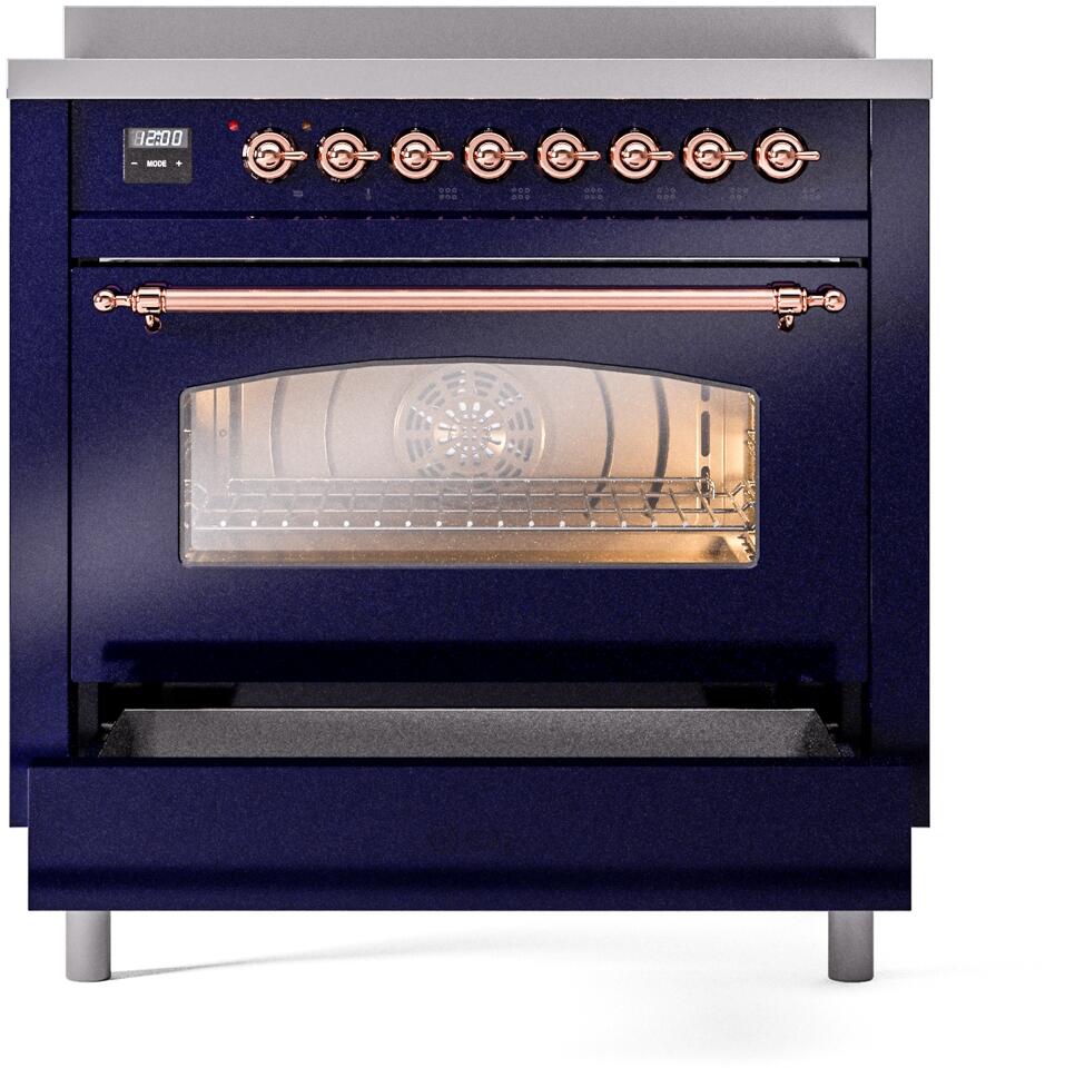 Freestanding induction range front with glass oven window and copper control knobs