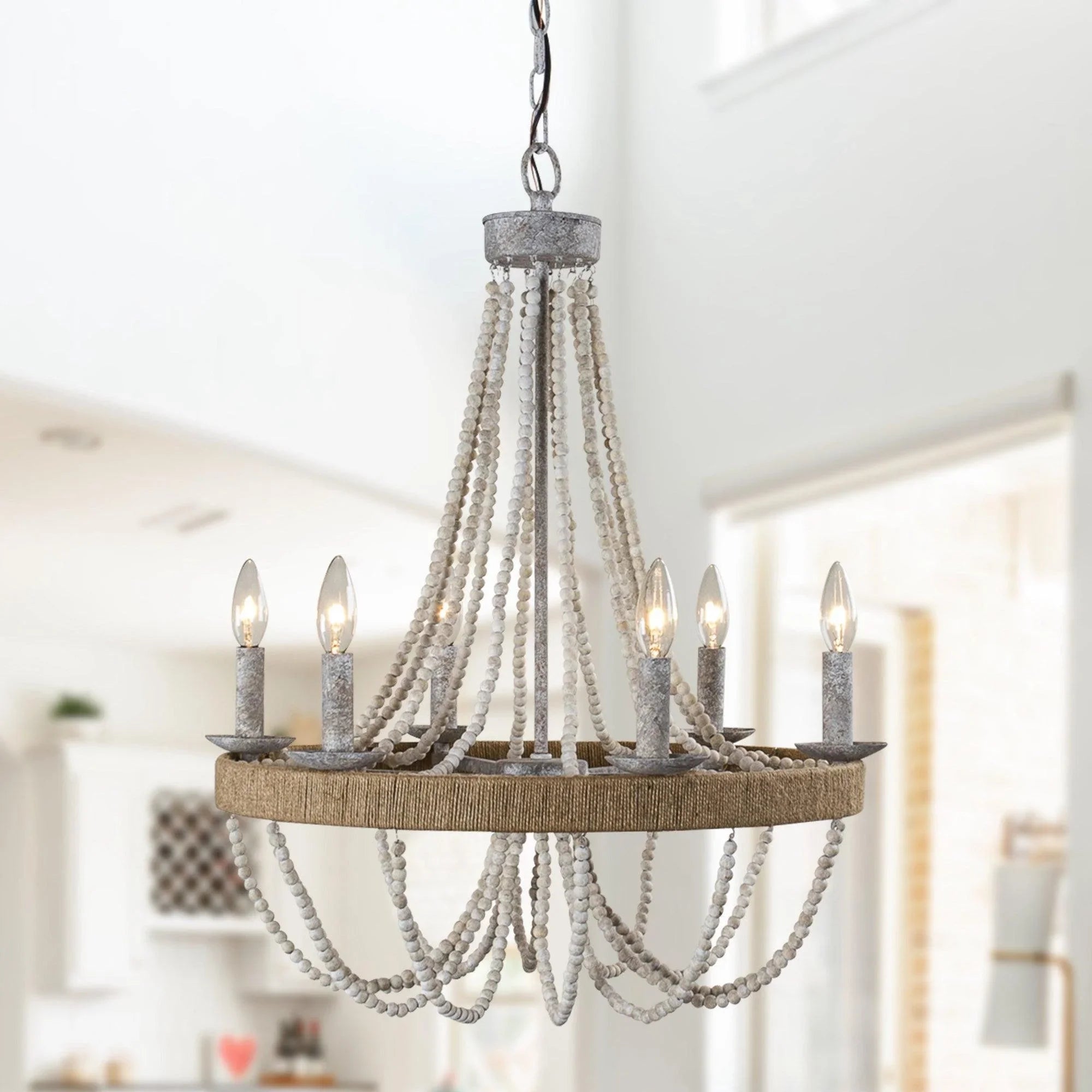 Wood bead chandelier with white bead strands and a round rustic ring holding 6 candles