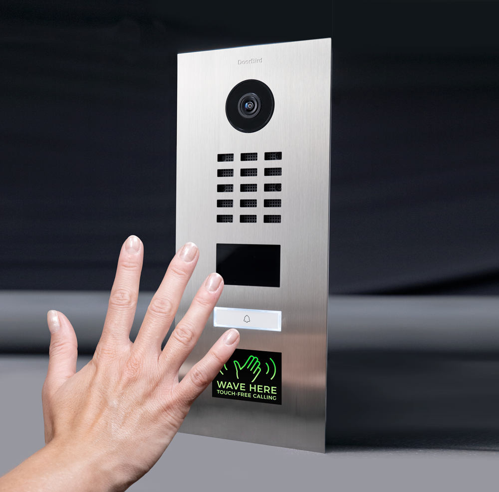 Stainless steel flush mount video door station with camera lens, keypad, and Wave Here