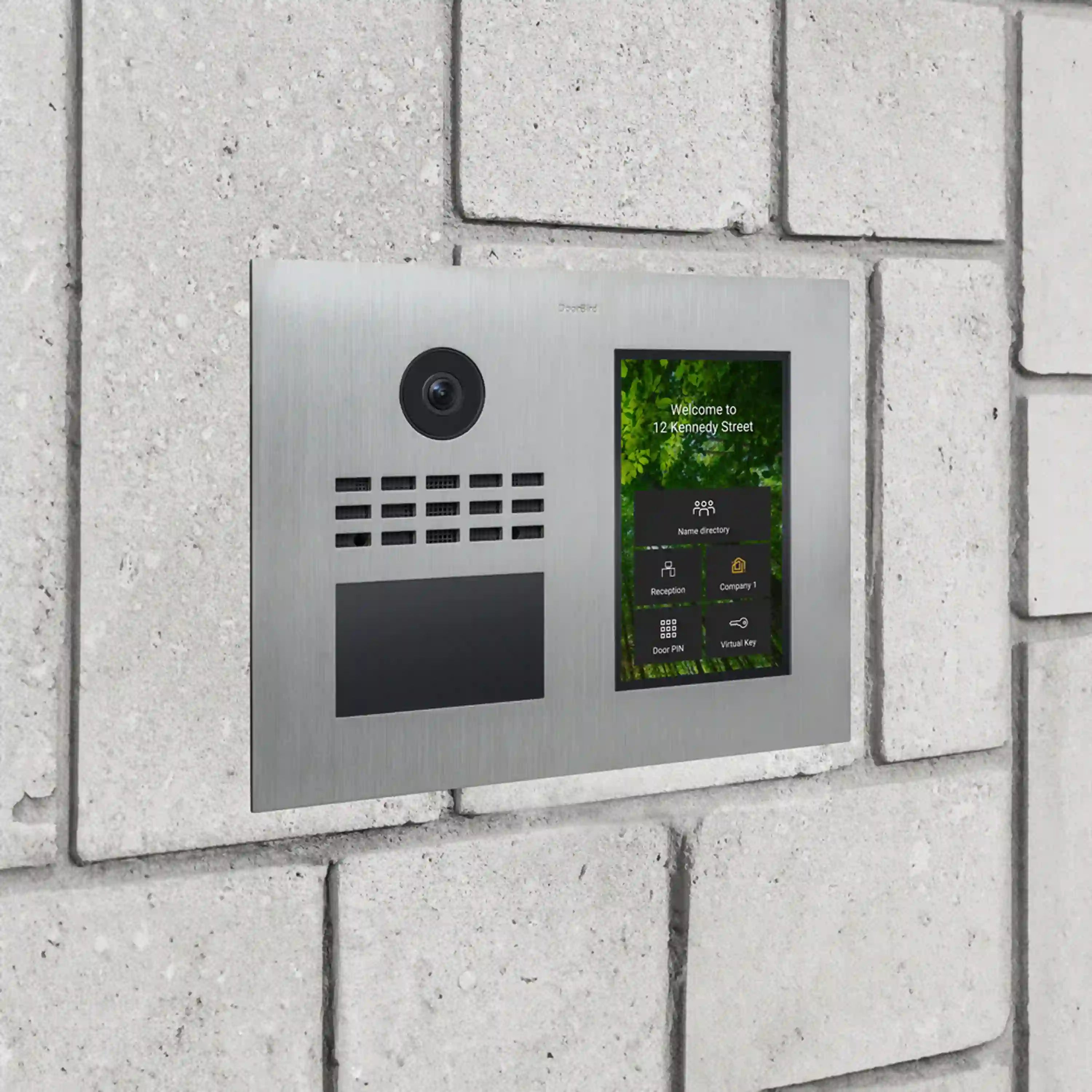 Wall-mounted stainless steel video intercom with camera lens and illuminated directory screen