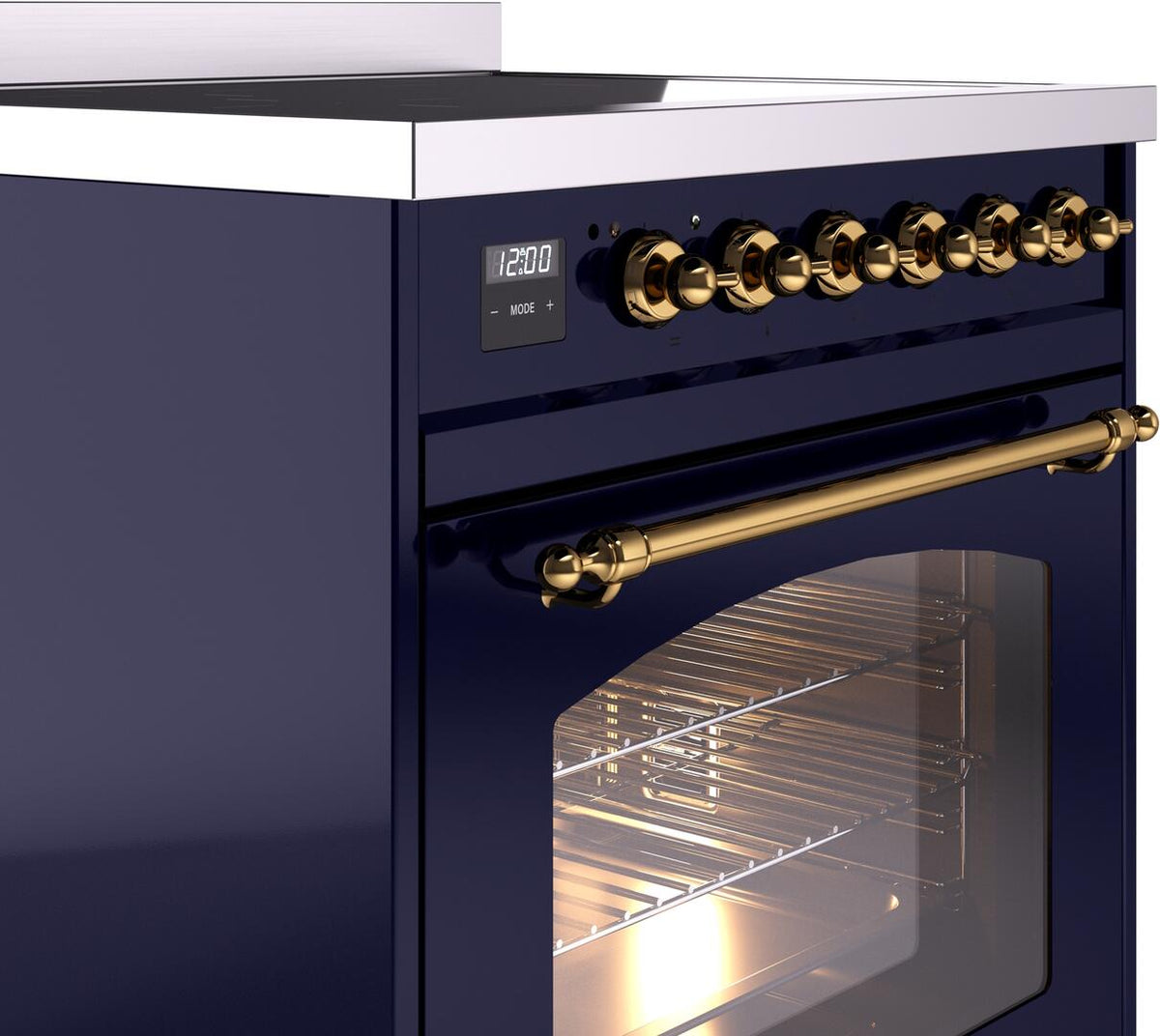 Freestanding electric induction range control panel with brass knobs and rail, oven door ajar