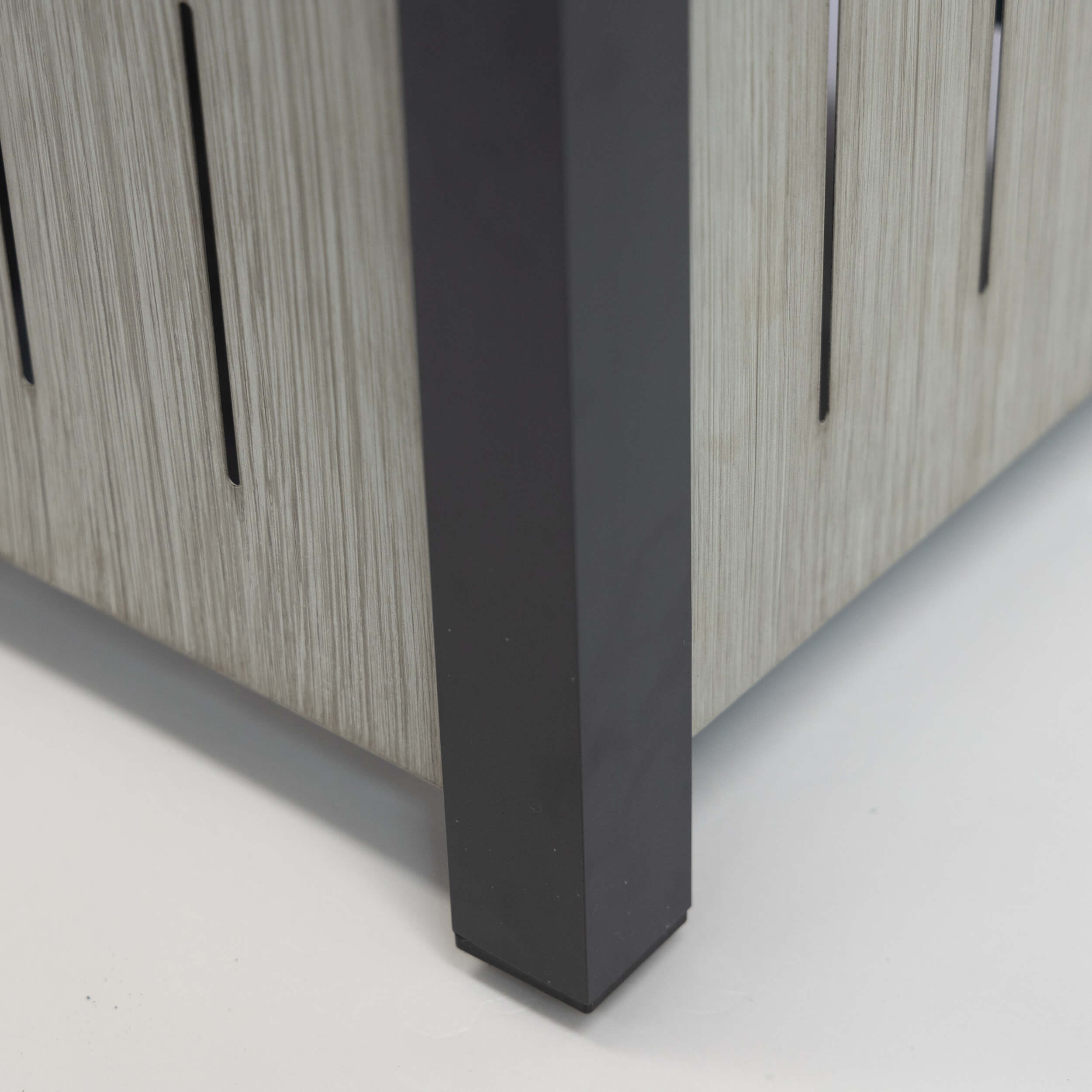 Rectangular firetable with black legs and light wood slatted cabinet side panel