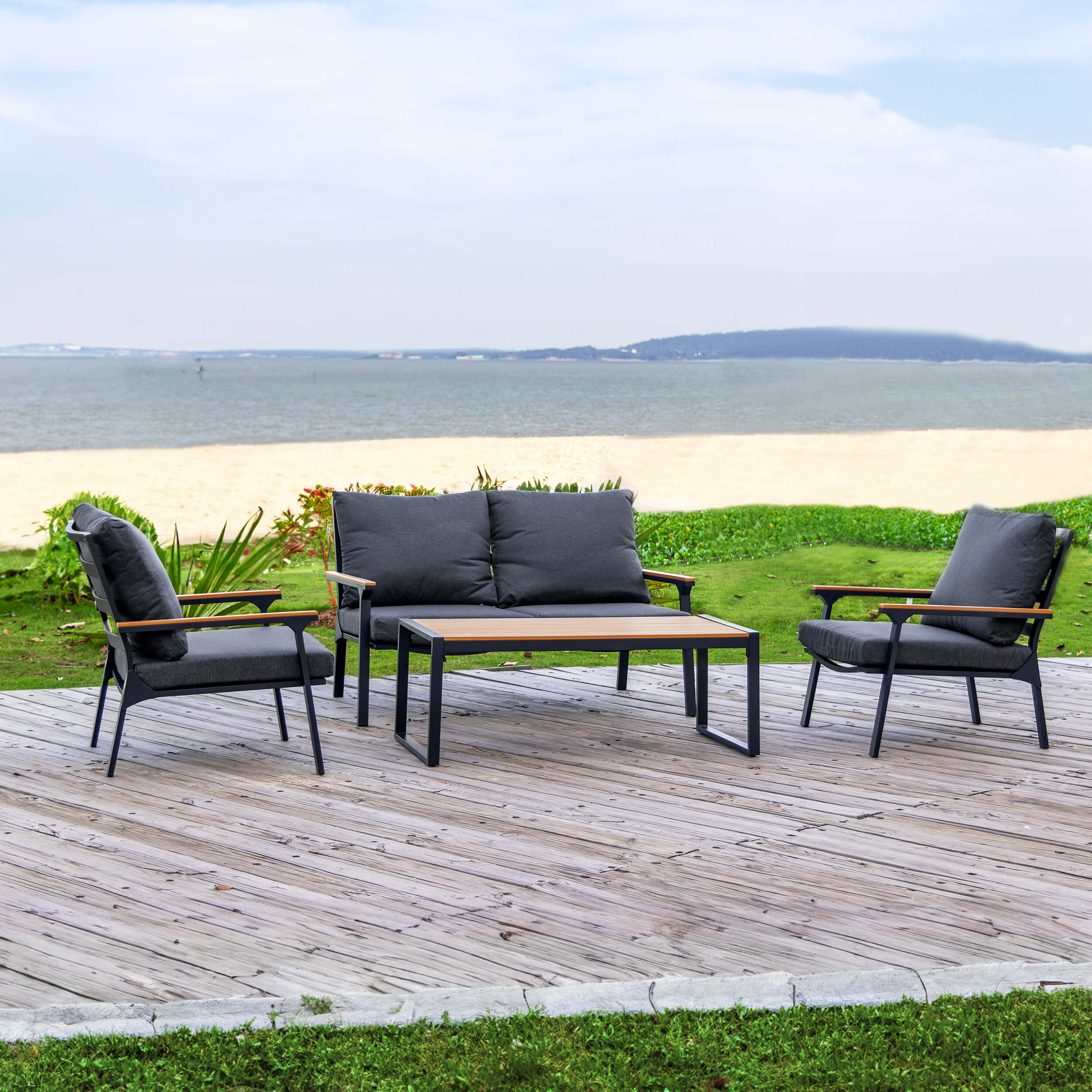 Outdoor sofa set with two armchairs, gray cushions, and rectangular coffee table