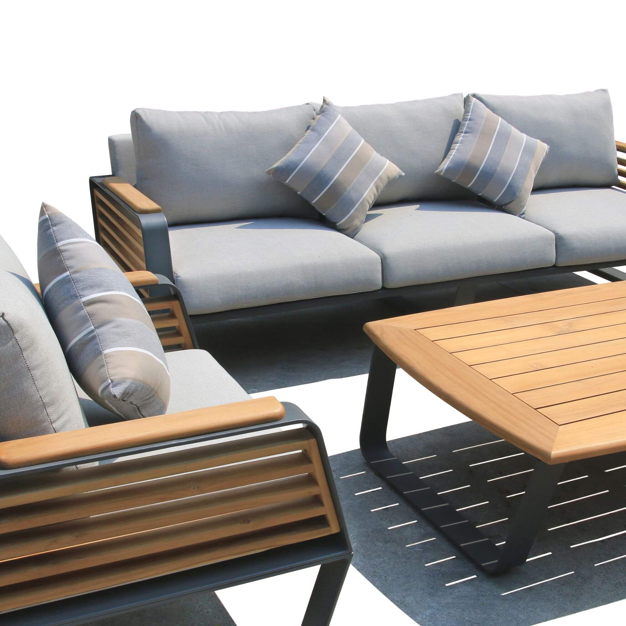 Loveseat and chairs with light gray cushions, striped pillows, and dark slatted frames