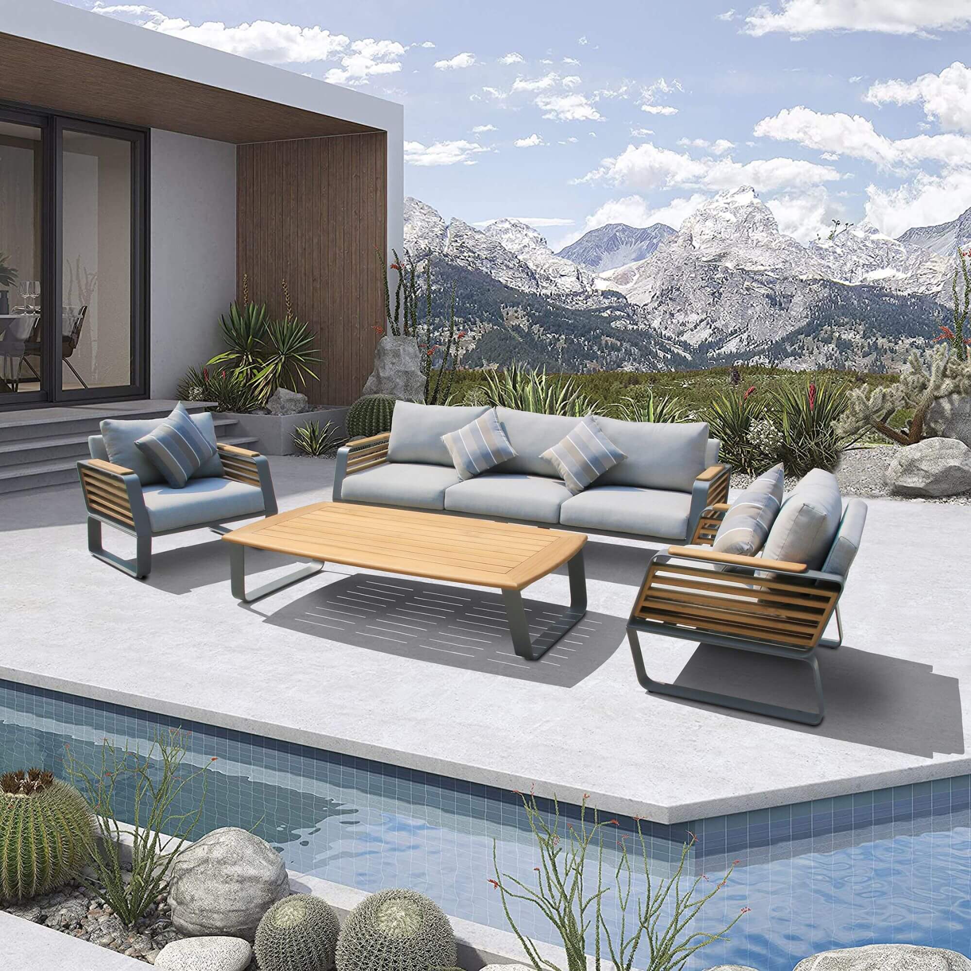 Outdoor patio furniture set with coffee table, loveseat, and two chairs with gray cushions