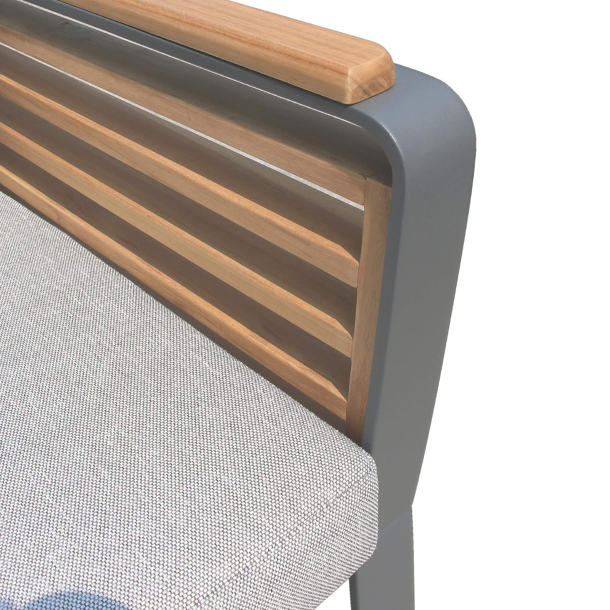 Detail of dark metal arm with warm wood slat backrest on outdoor seating