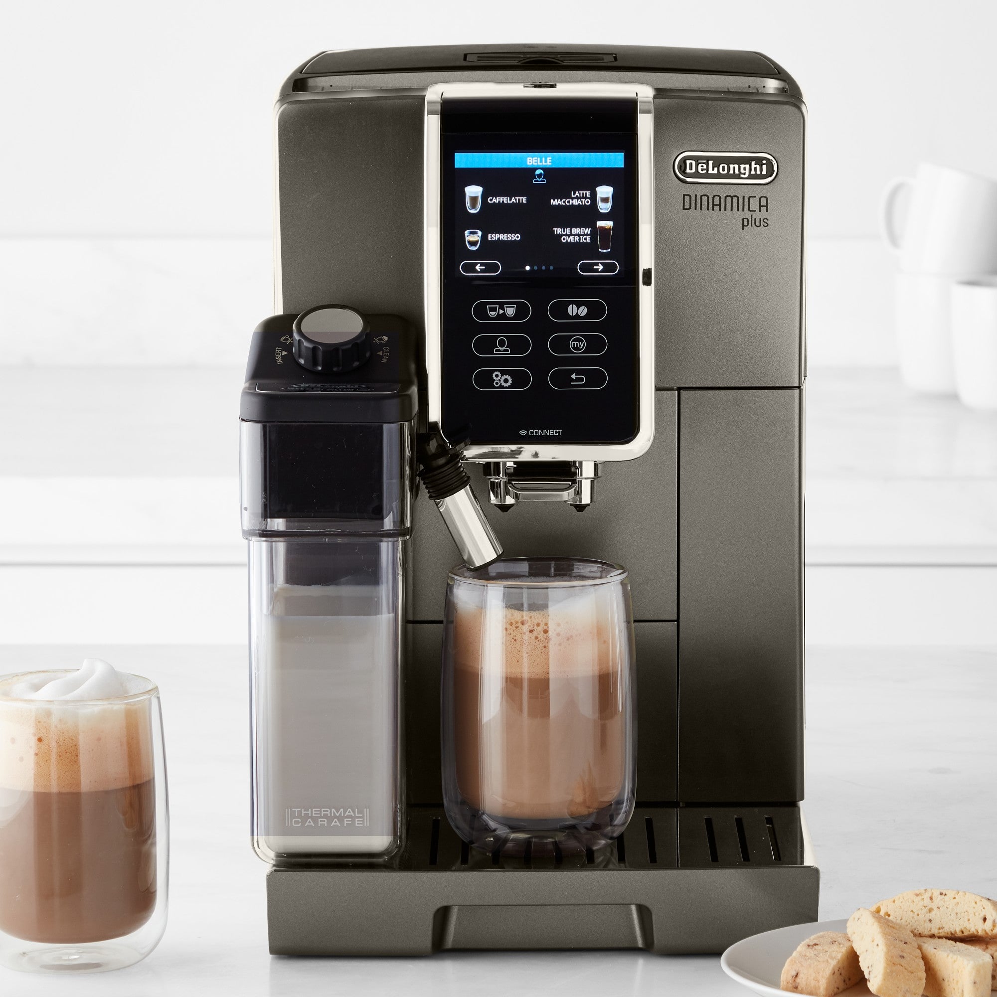 Super automatic espresso machine with frother nozzles and glass milk container, front view
