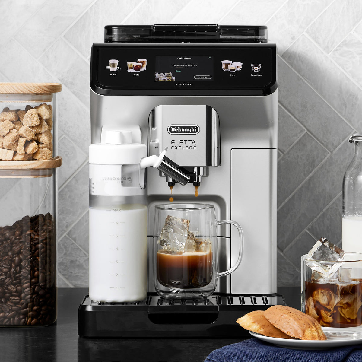 Fully automatic espresso machine with cold brew carafe, milk container, and drip tray