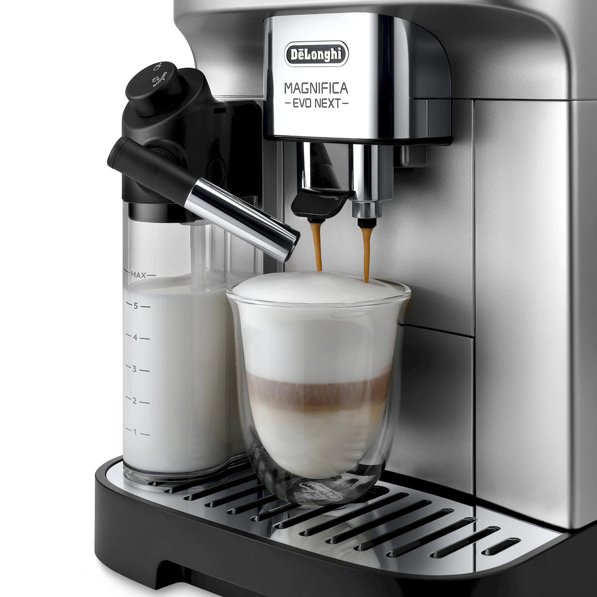 Fully automatic espresso machine dispensing coffee into a clear glass cup, stainless and black.