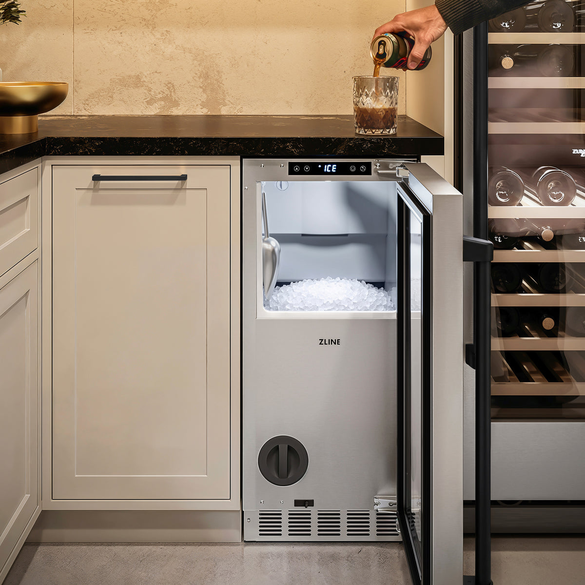 Filling a glass with nugget ice from the ZLINE Autograph Edition ice maker in a cellar nook (INGDZ-ST-15-MB)