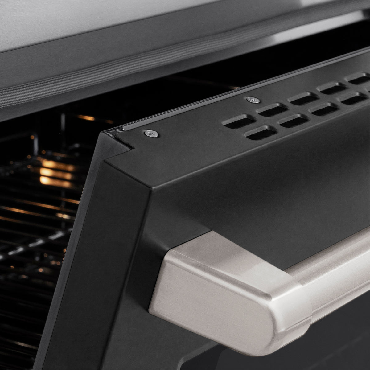Close-up of the stainless steel handle on the ZLINE Paramount Induction Range (SINR-BLM-48)