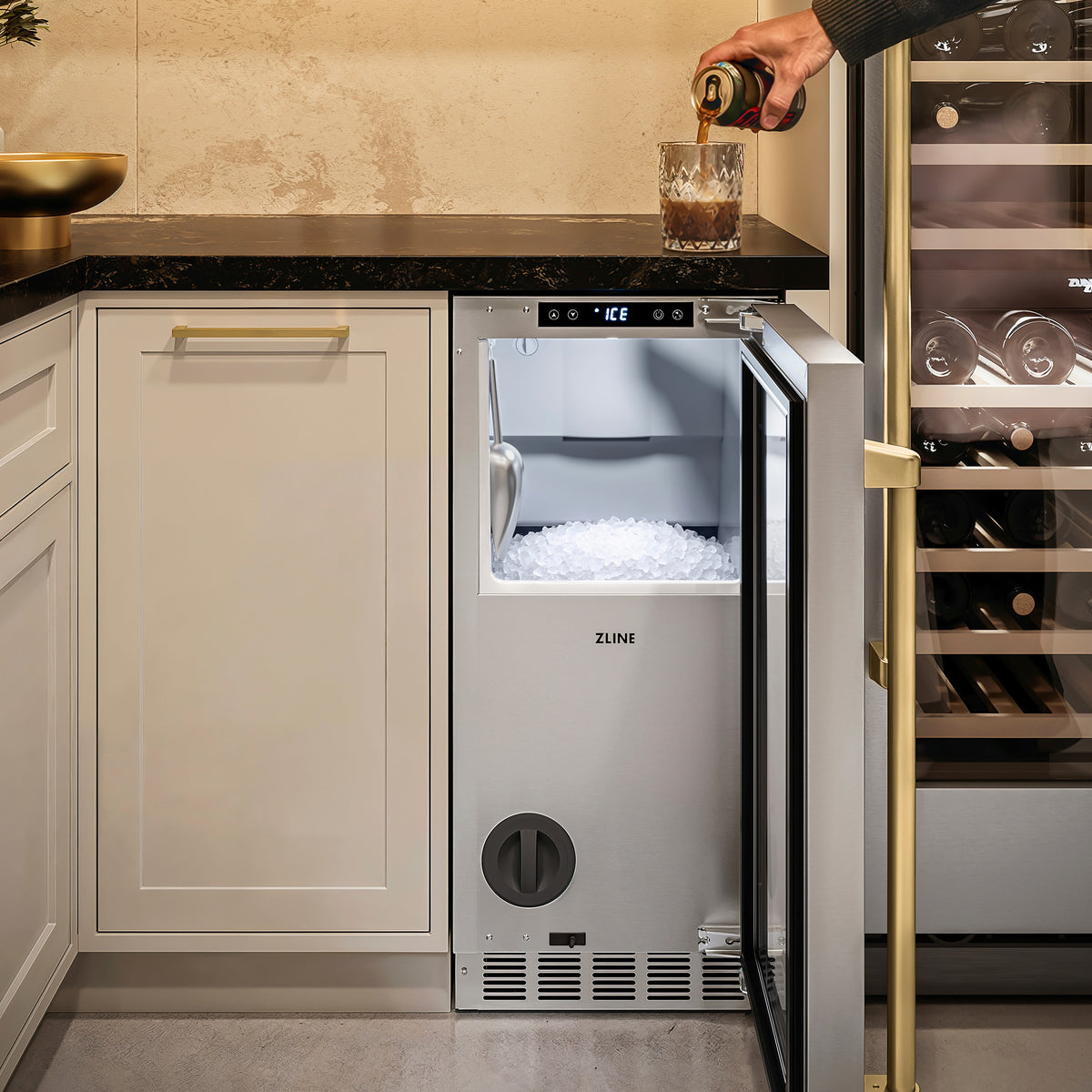 Filling a glass with nugget ice from the ZLINE Autograph Edition ice maker in a cellar nook (INGDZ-ST-15-CB)
