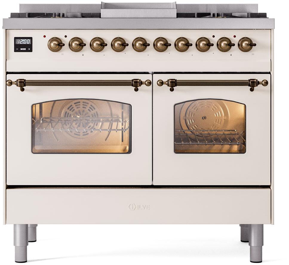 Antique white freestanding dual fuel range with bronze knobs and two glass oven doors