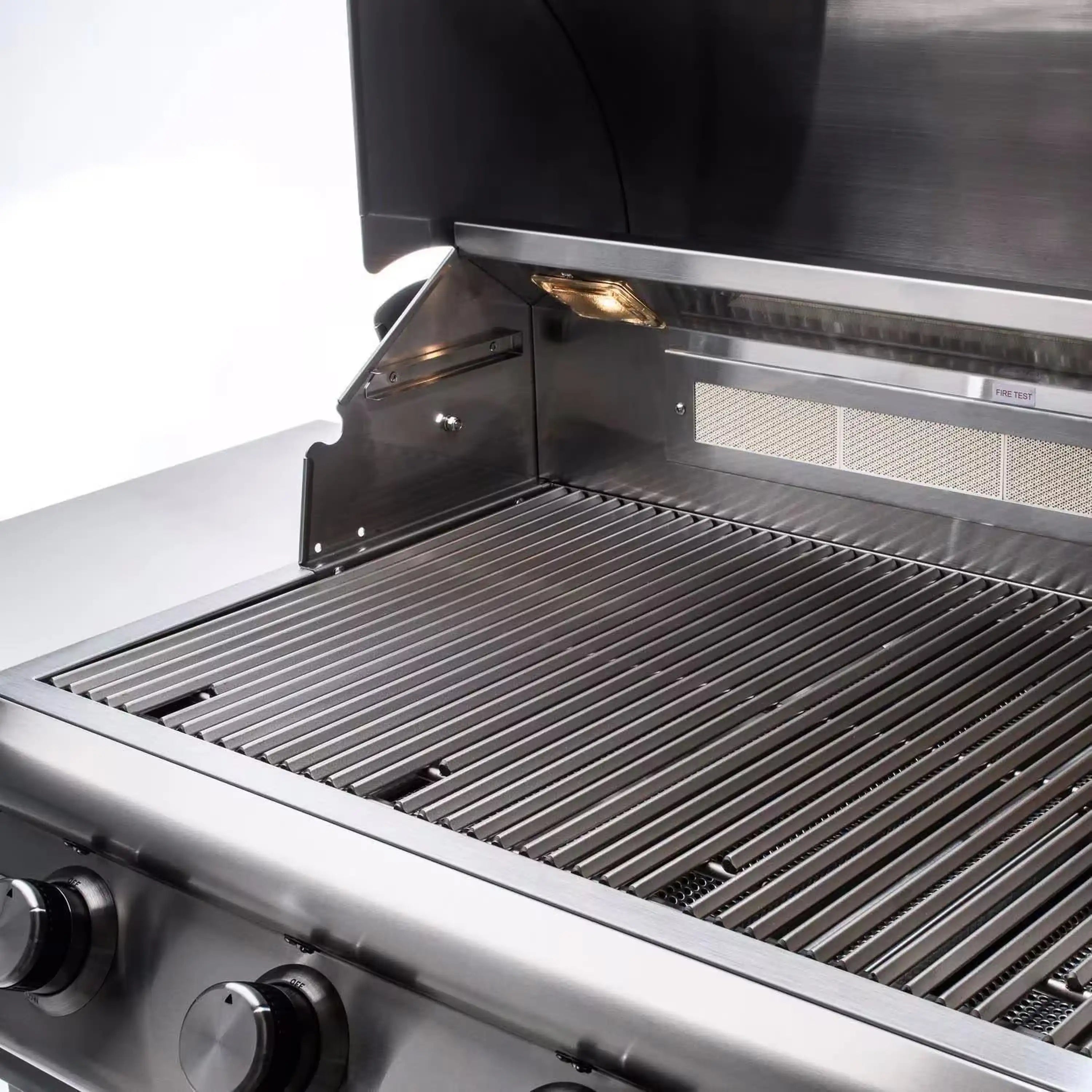 Stainless steel grill cooking grate with warming rack and open lid hood