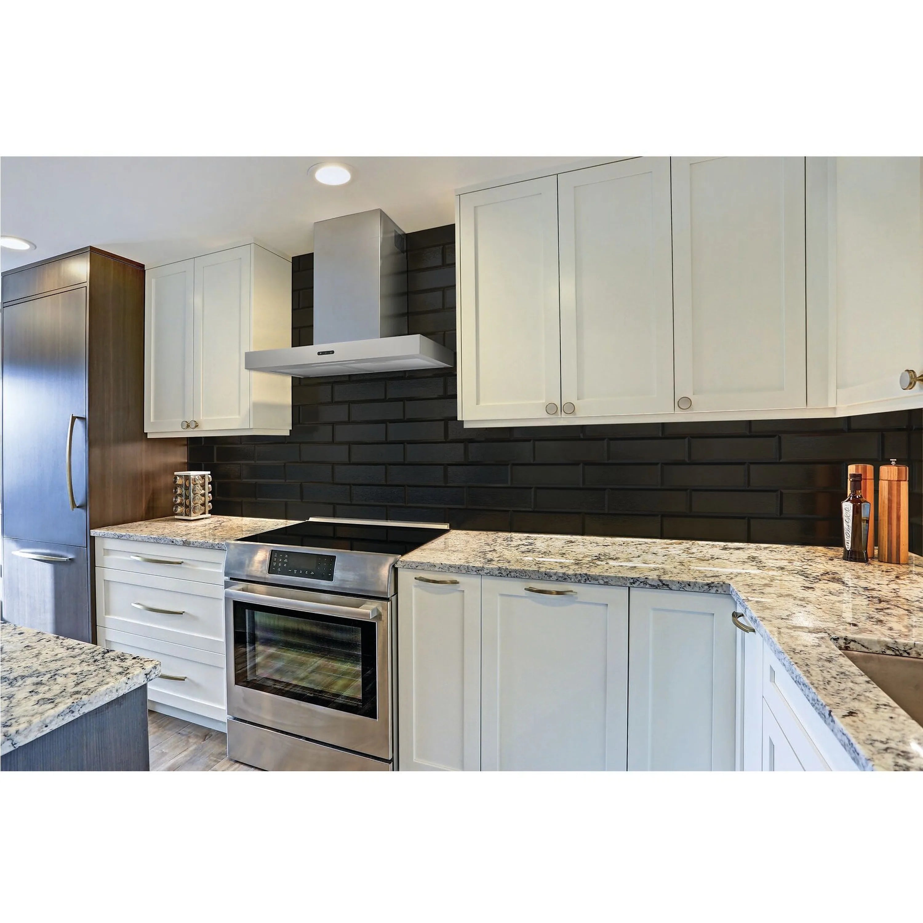 Stainless steel chimney range hood mounted over stove with front controls