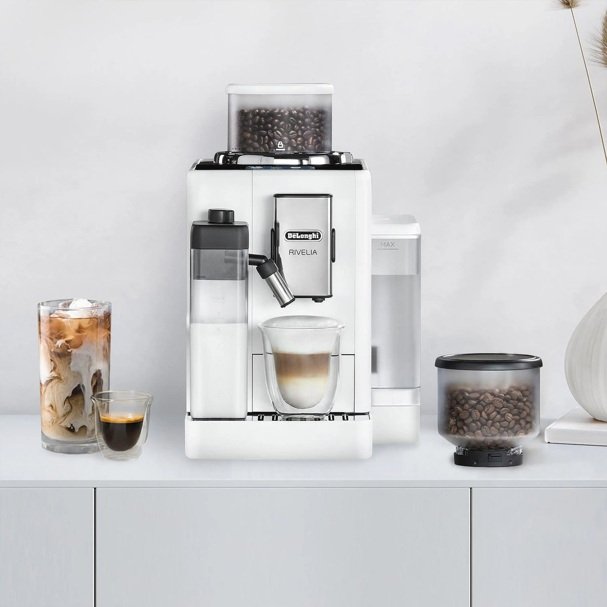 White fully automatic espresso machine with bean hopper, milk container, and coffee cup