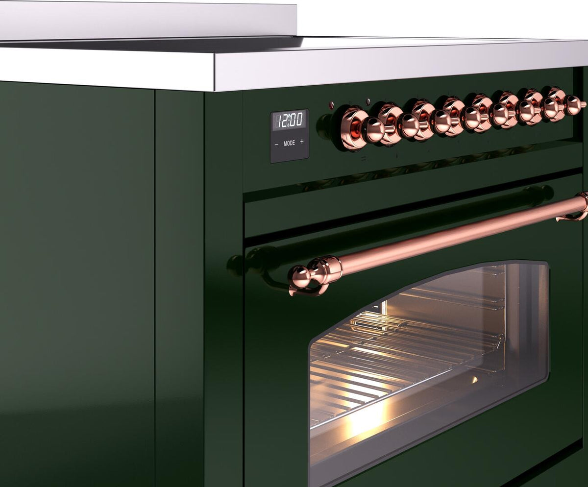 Freestanding range detail of copper control knobs and door with oven window.