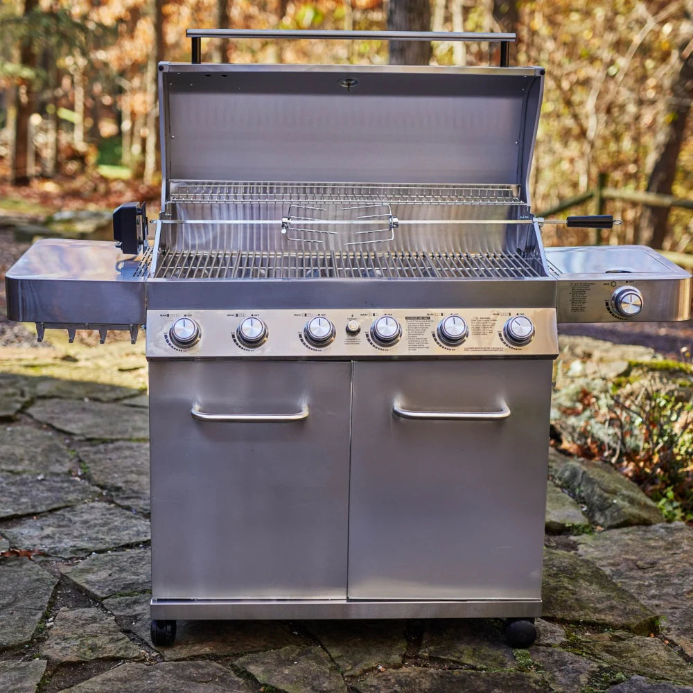 Stainless steel propane grill with open lid, wire warming rack, and two front doors