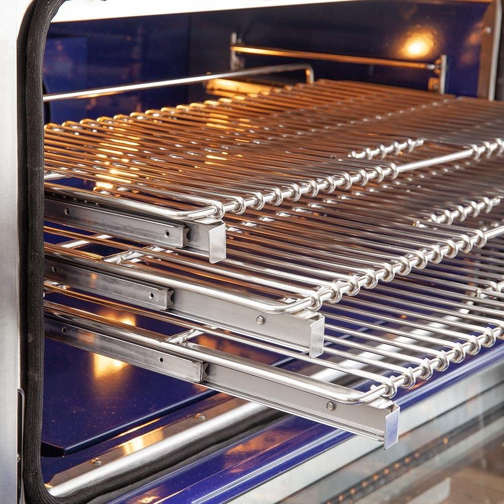 Gas oven wire rack with stacked metal bars and lit heating elements below