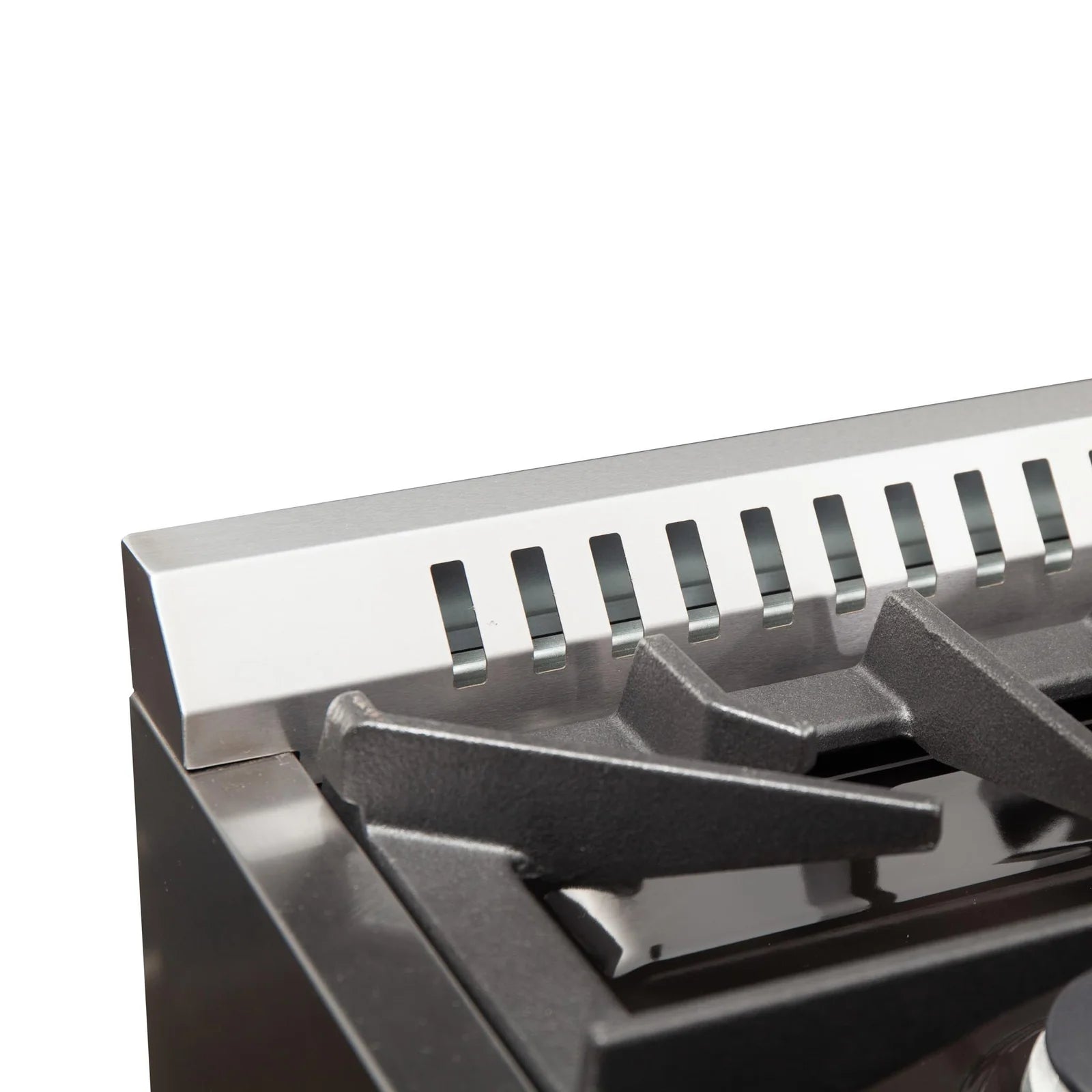 Griddle pan on a stainless steel dual-fuel range cooktop, close-up