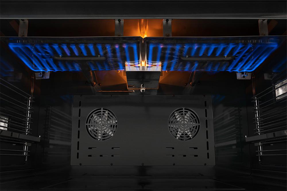 Gas range oven interior with blue heating lights and two cooling fans