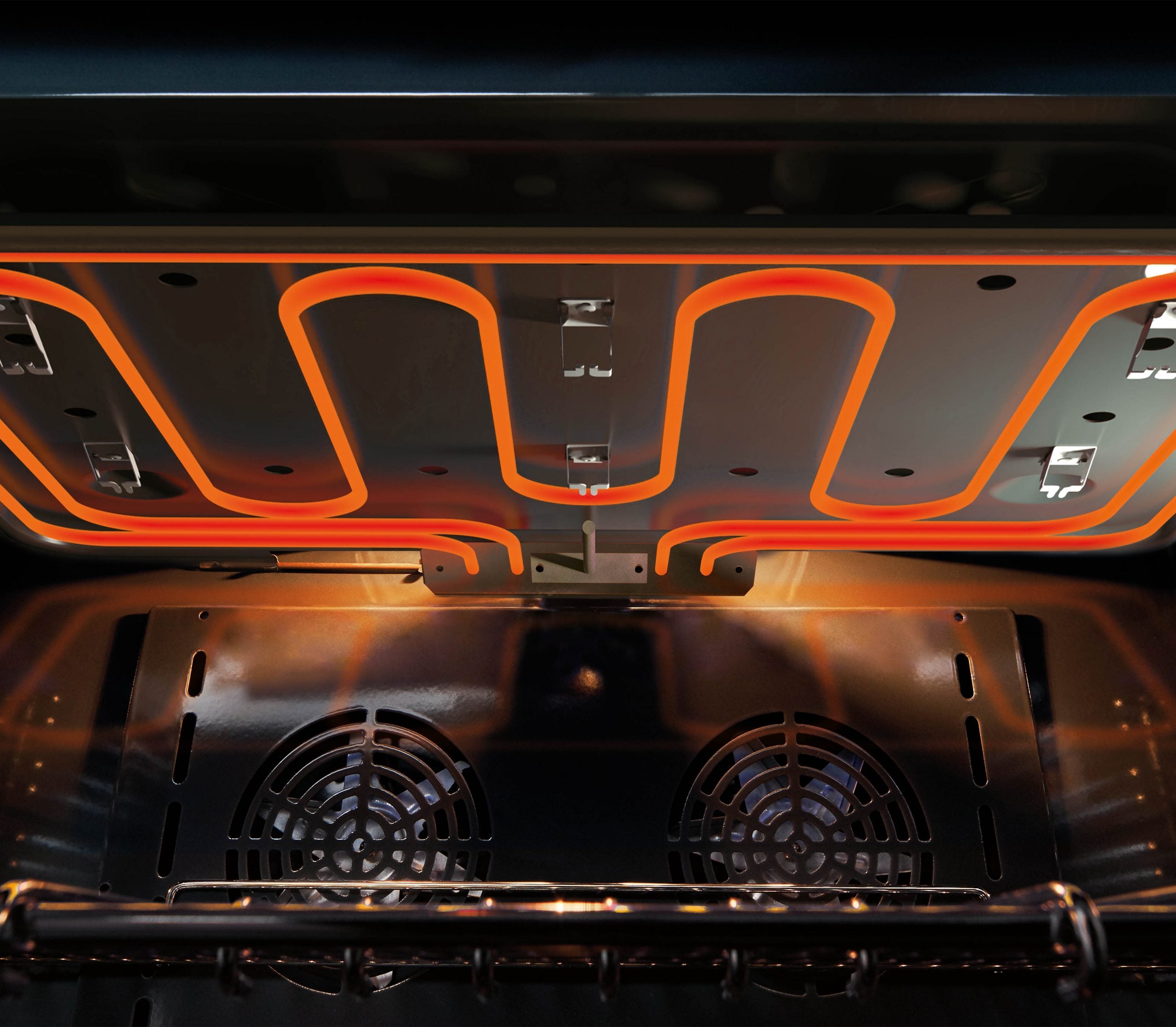 Open oven interior with dual burners and reflective heating surfaces