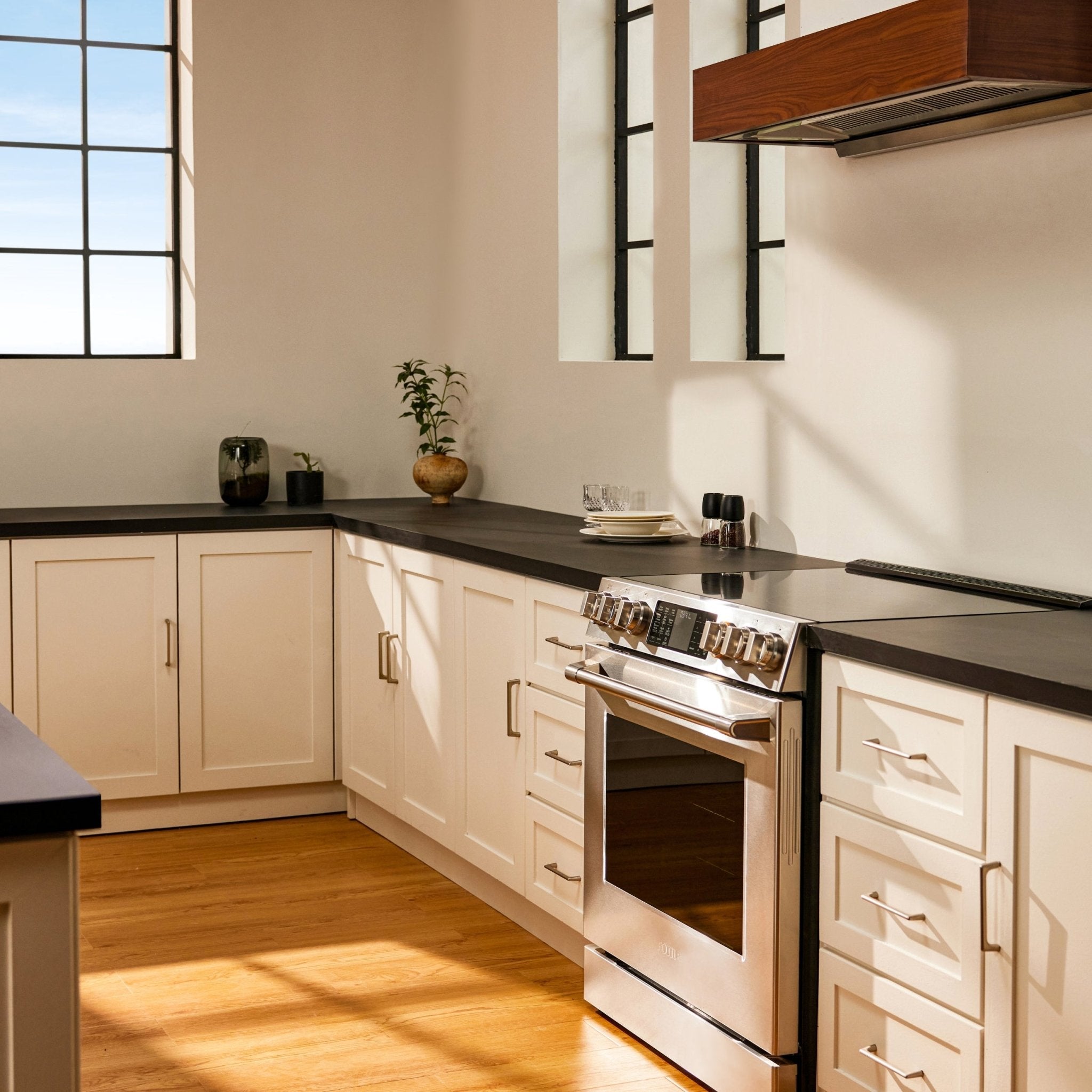 Stainless steel slide-in electric range with oven door and cooktop control panel