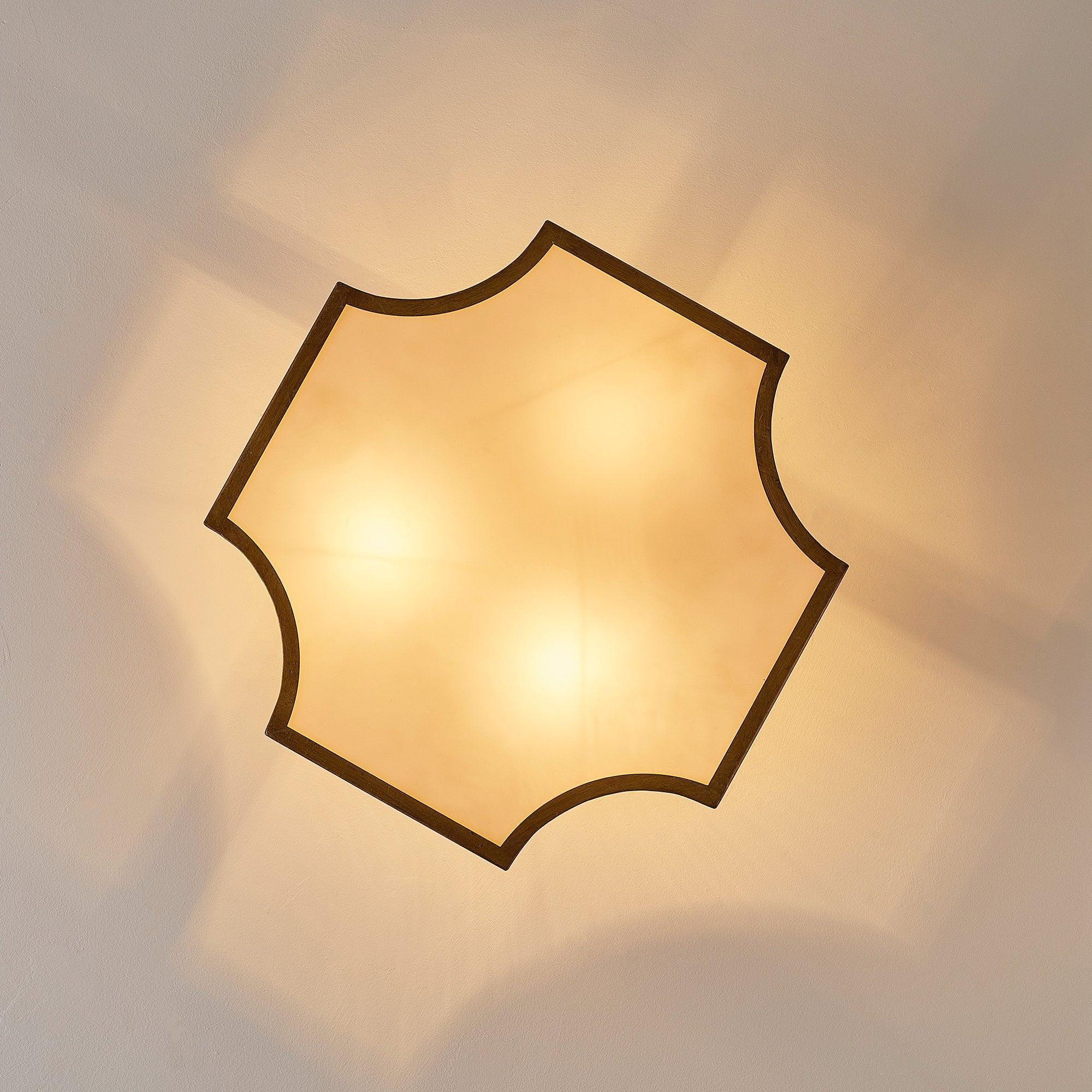 Golden semi-flush ceiling light with octagon-style acrylic diffuser and brass trim