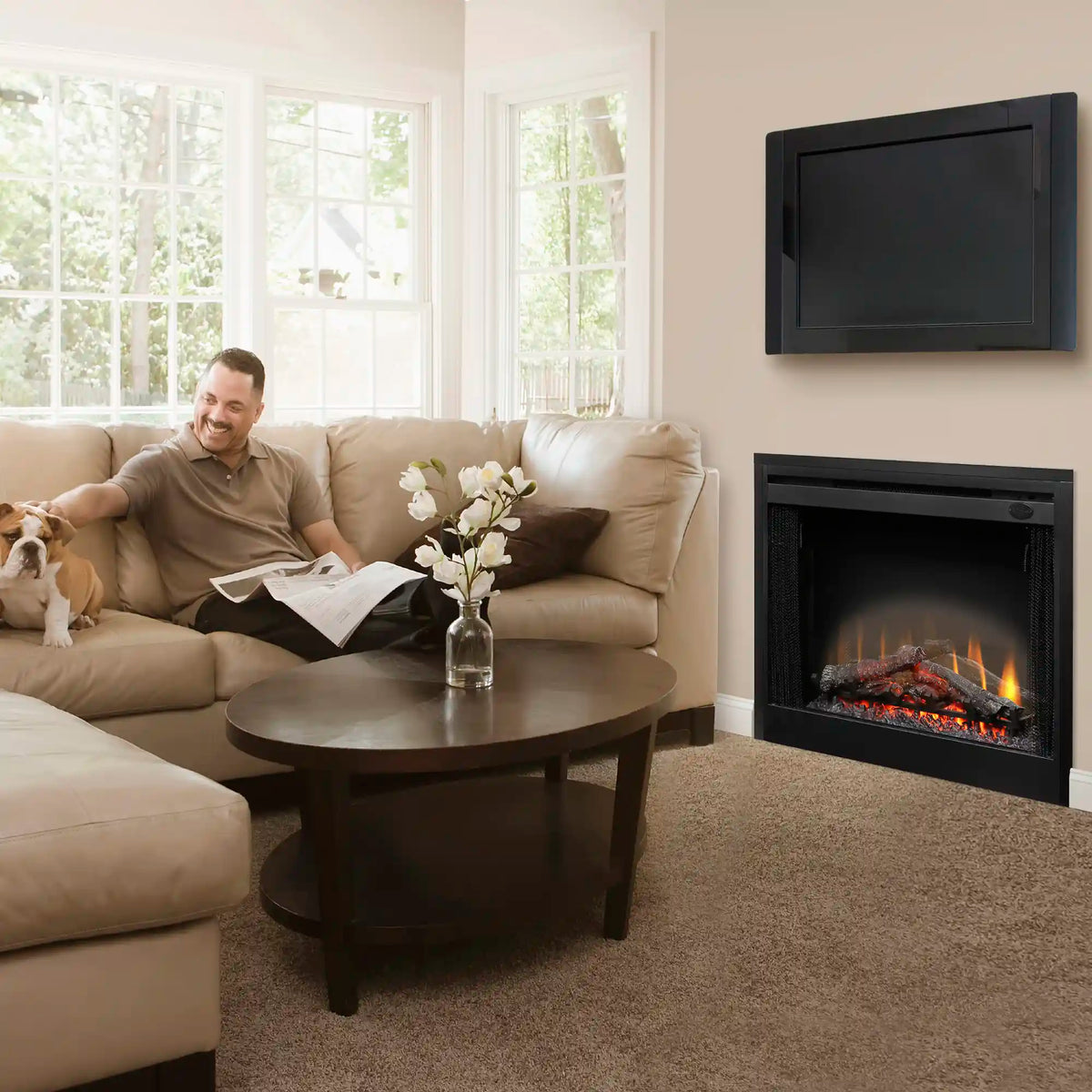 Black electric fireplace insert with glass front and flame display, mounted in wall
