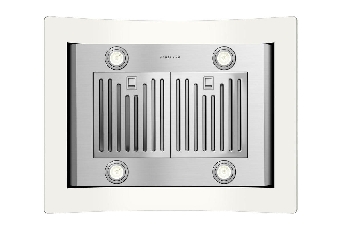 Stainless steel hood fan area with four circular lights and vented baffle grille