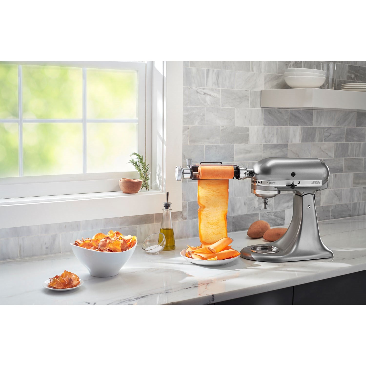 Vegetable sheet cutter attachment on stand mixer producing long vegetable strips