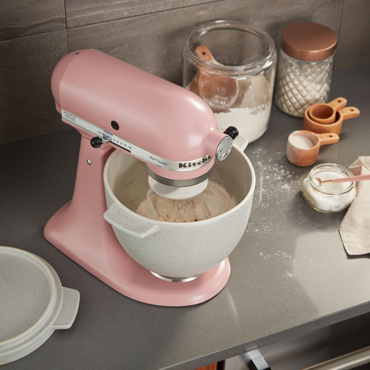Matte dried rose stand mixer mixing batter in a stainless bowl