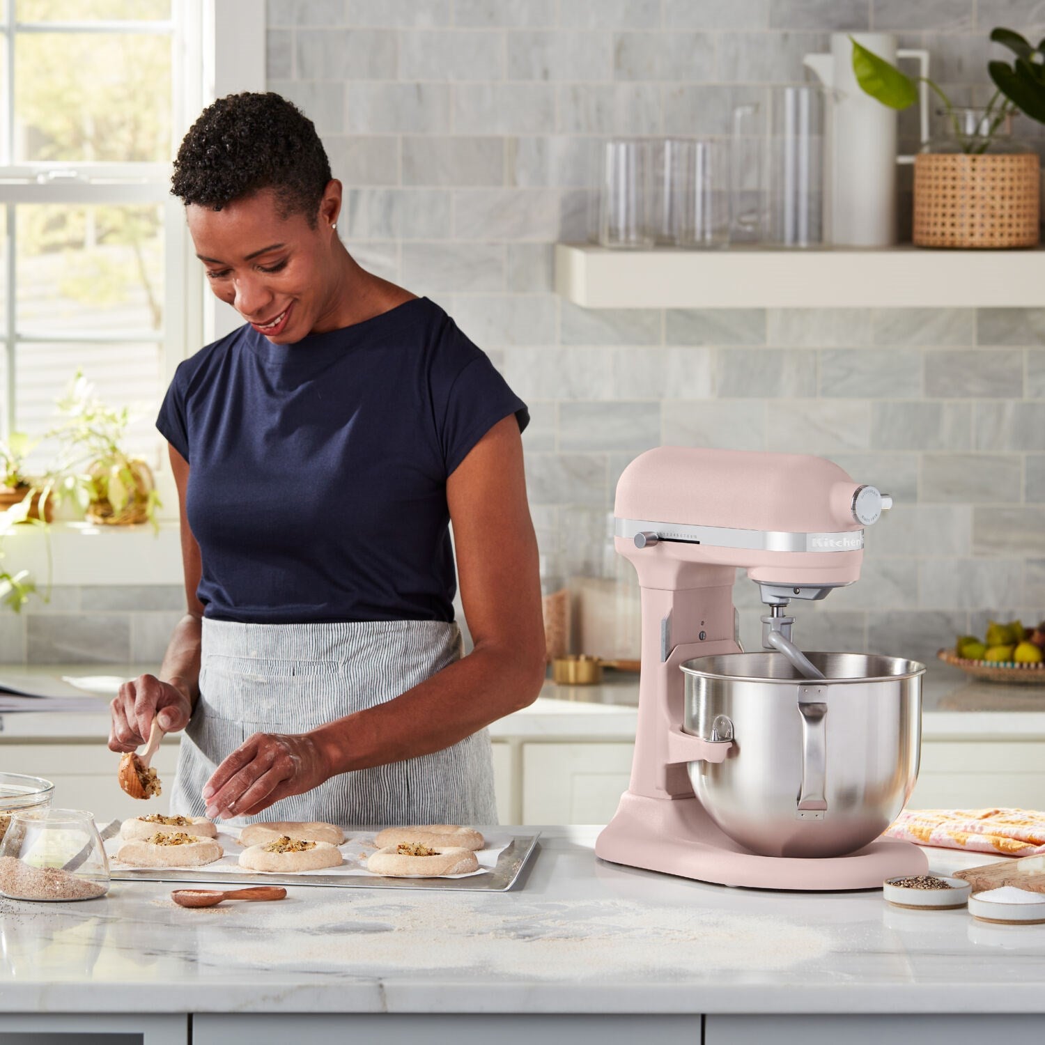 Feather Pink stand mixer on countertop while baking dough