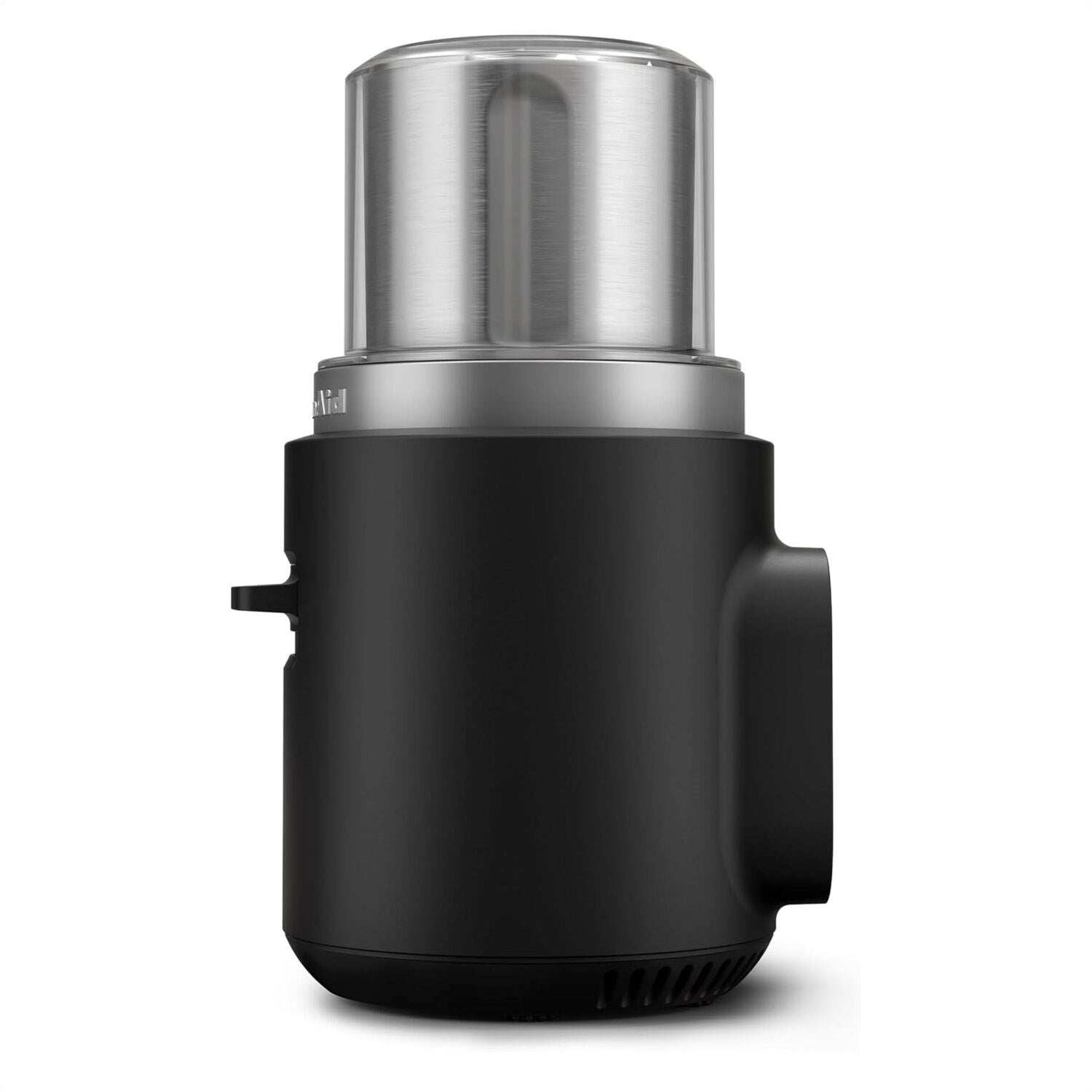 Black cordless coffee grinder with stainless top and side handle, shown from a front-left angle