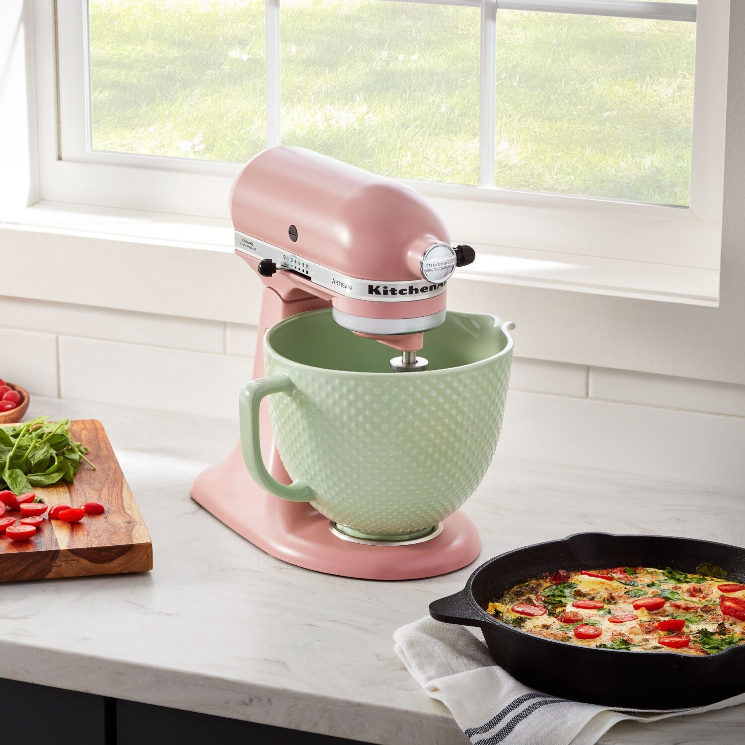 Matte dried rose stand mixer with green ceramic bowl and beater attachment