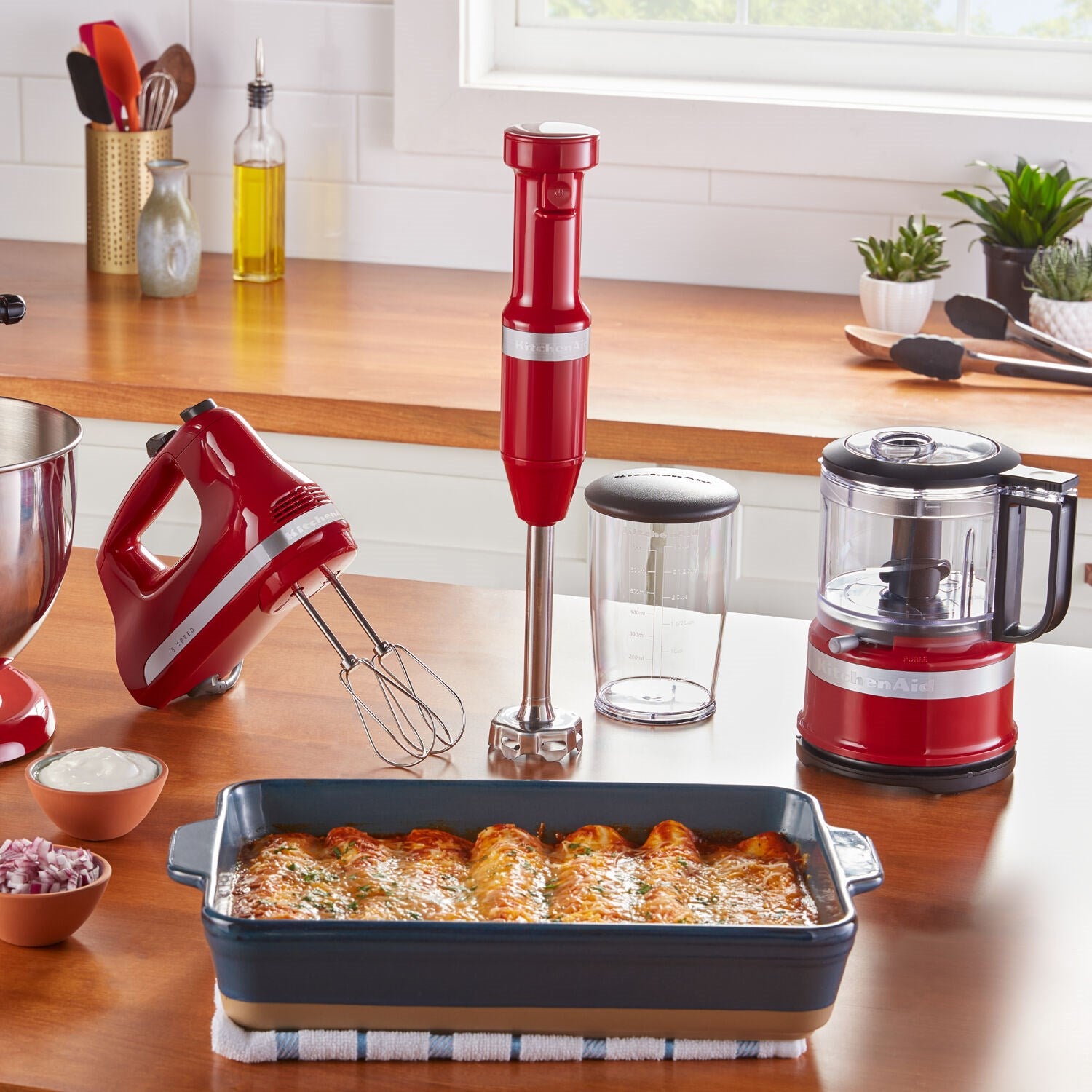 Empire Red KitchenAid food chopper on countertop with prep bowl and lid