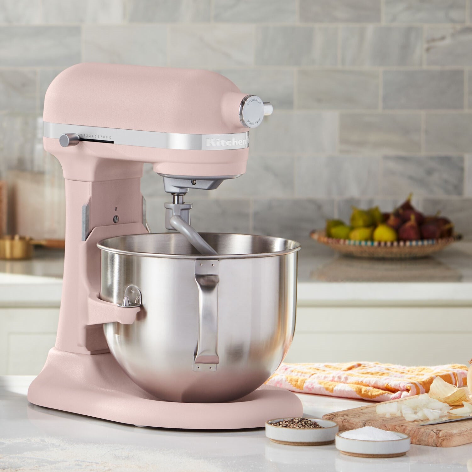 Feather Pink stand mixer with stainless steel bowl and mixing paddle attachment