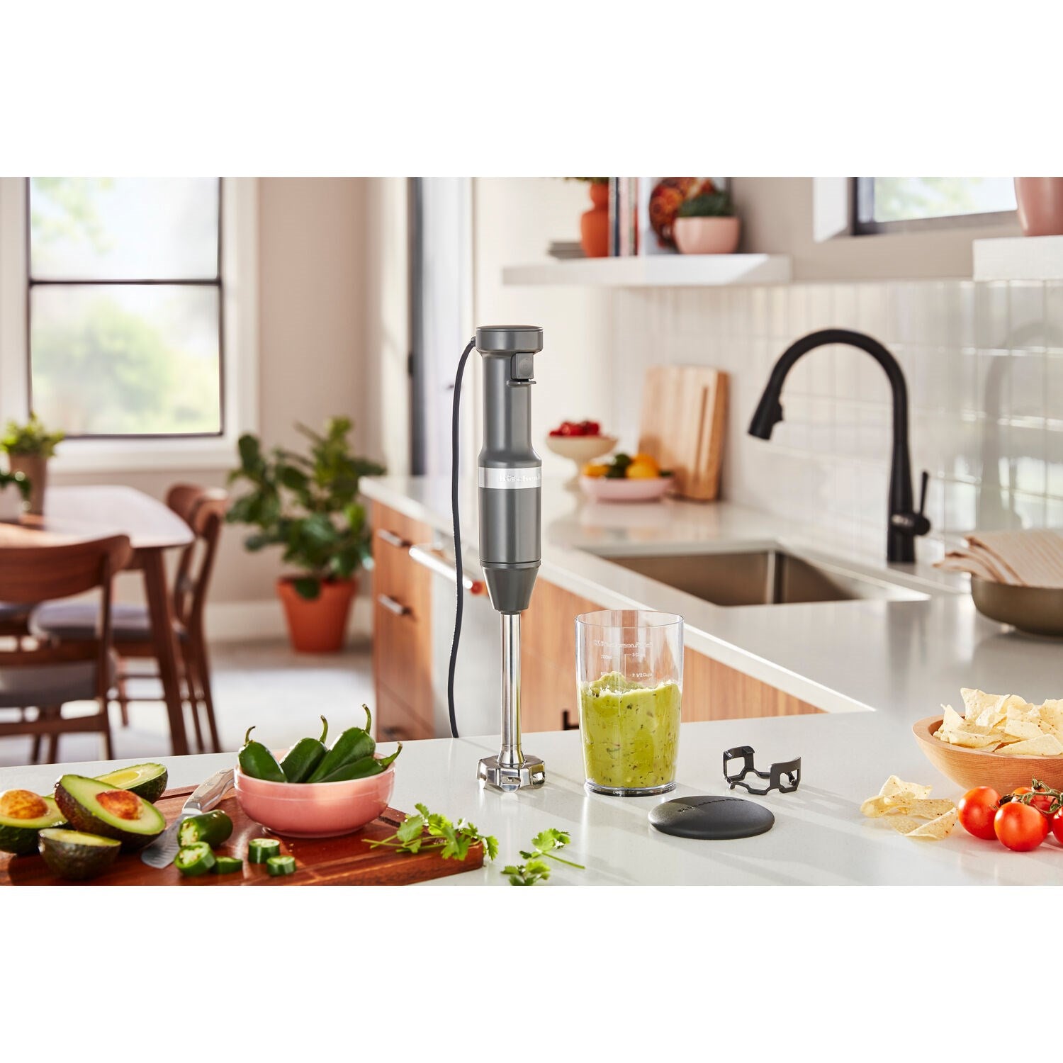 Immersion blender with blending jar and lid, blending in a tall jar