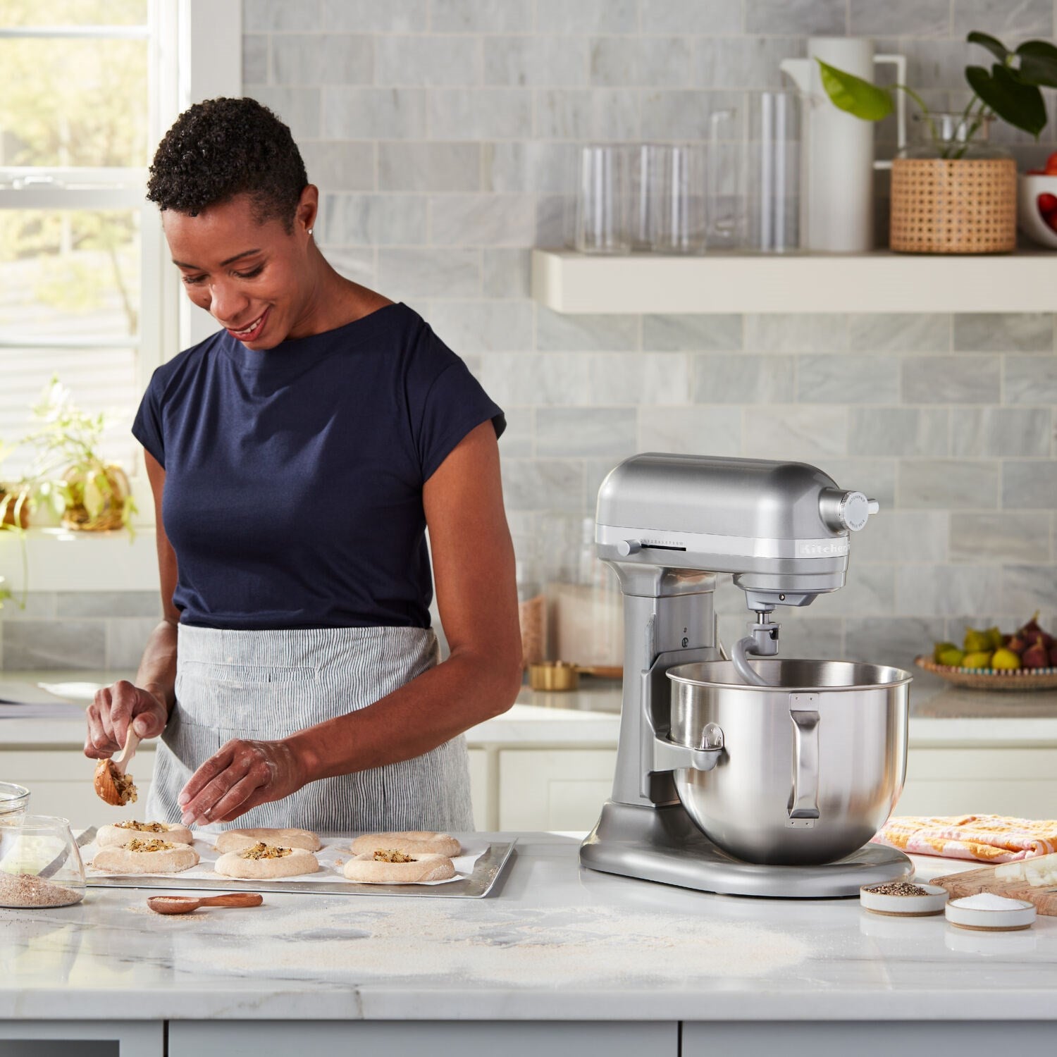 KitchenAid stand mixer with 7-quart bowl lift and flat beater, Contour Silver, in use