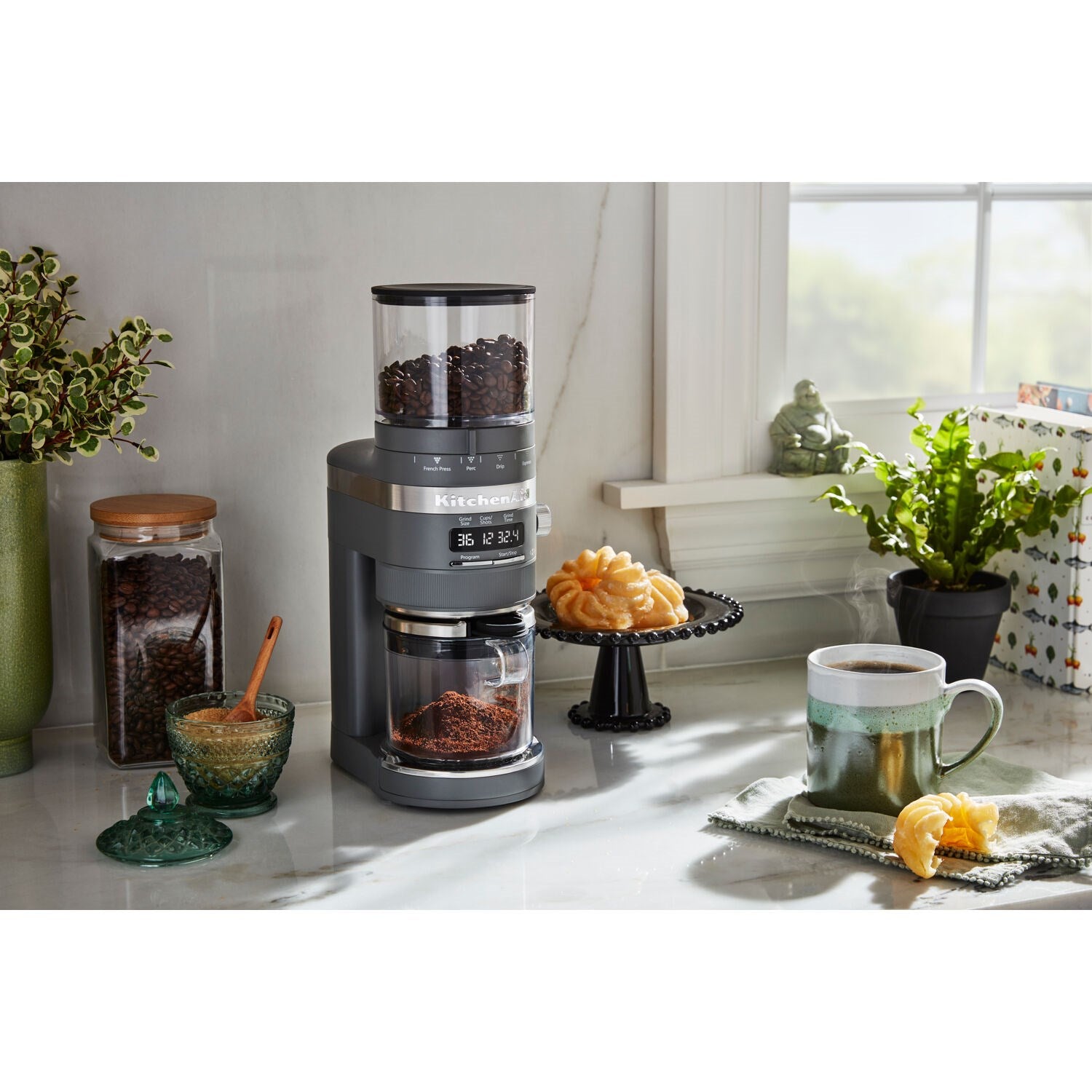 Charcoal grey burr coffee grinder with bean hopper on countertop