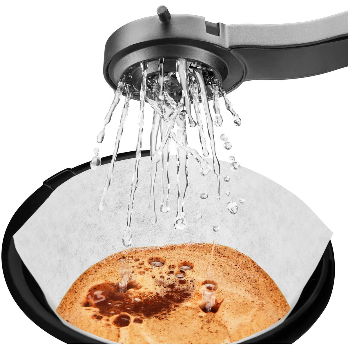 Water pouring from showerhead onto coffee bed in KitchenAid drip brewer