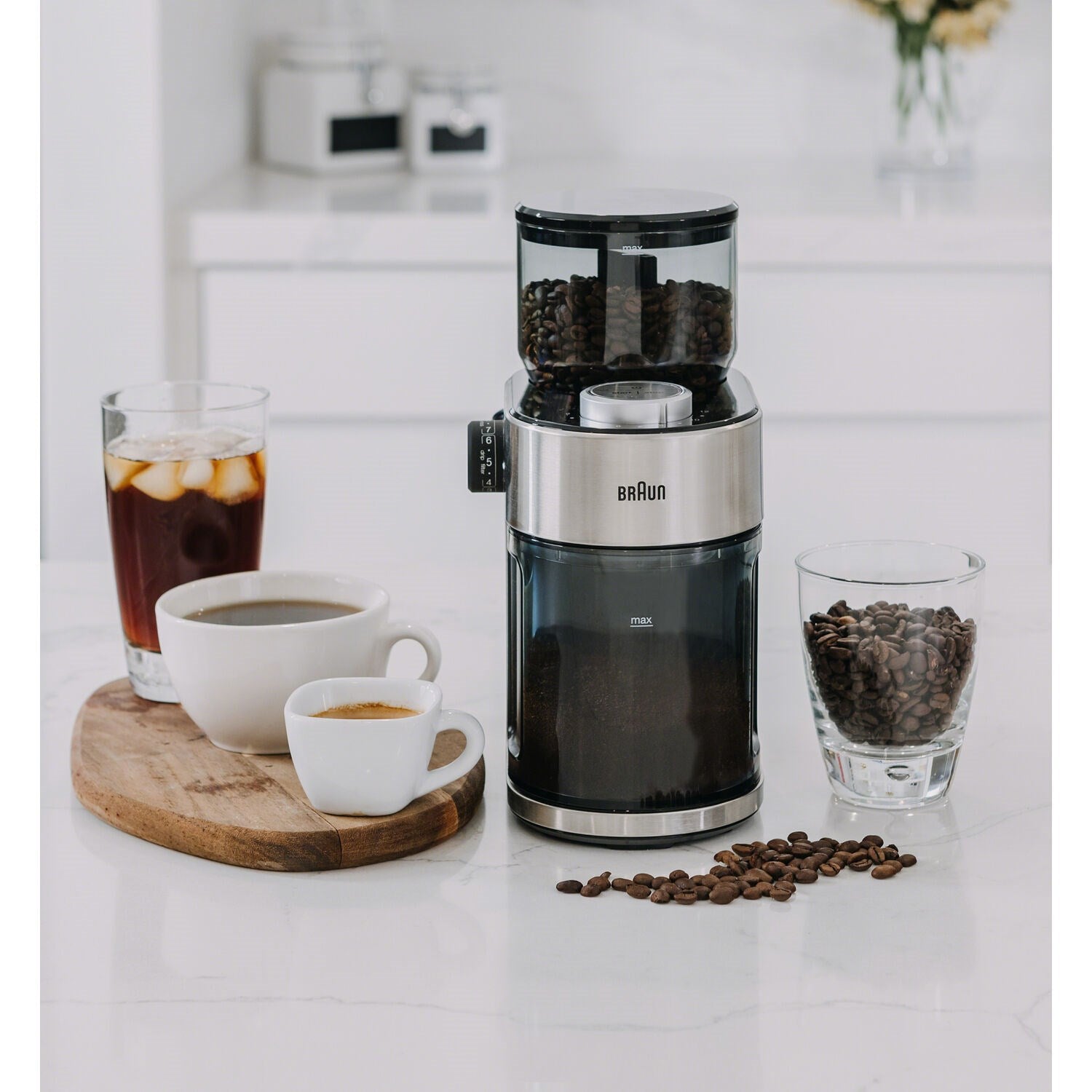 Burr coffee grinder with clear top bean hopper, stainless body, and black base