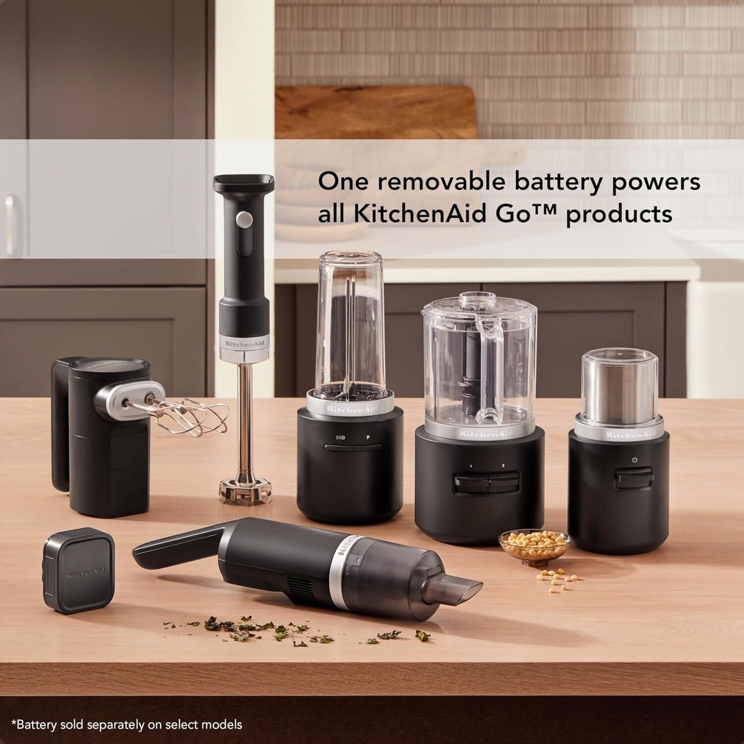 Black matte KitchenAid Go cordless coffee grinder system with multiple grinder attachments