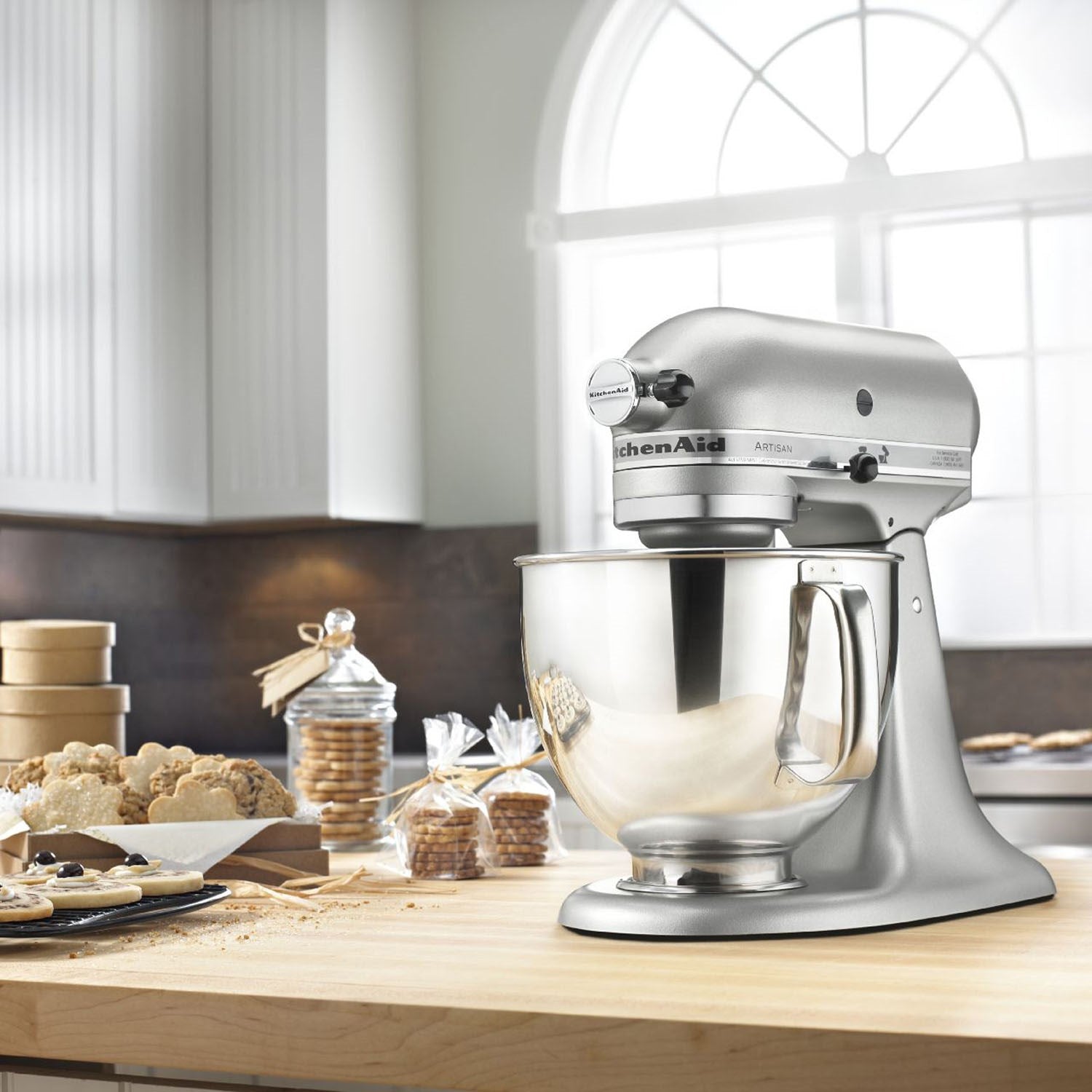 Contour silver tilt-head stand mixer on countertop with stainless bowl