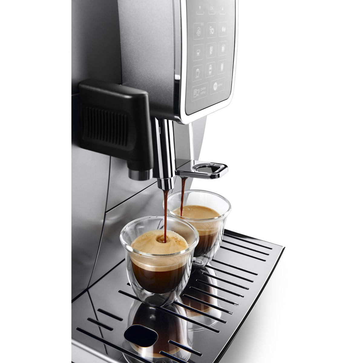 Milk frother pouring espresso into a cup above drip tray