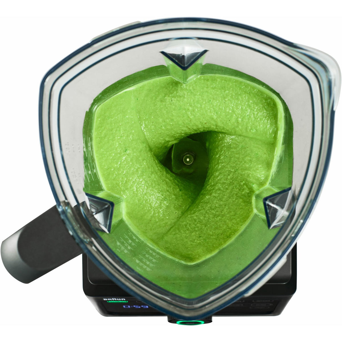 Clear blender jar filled with bright green puree and metal rotor