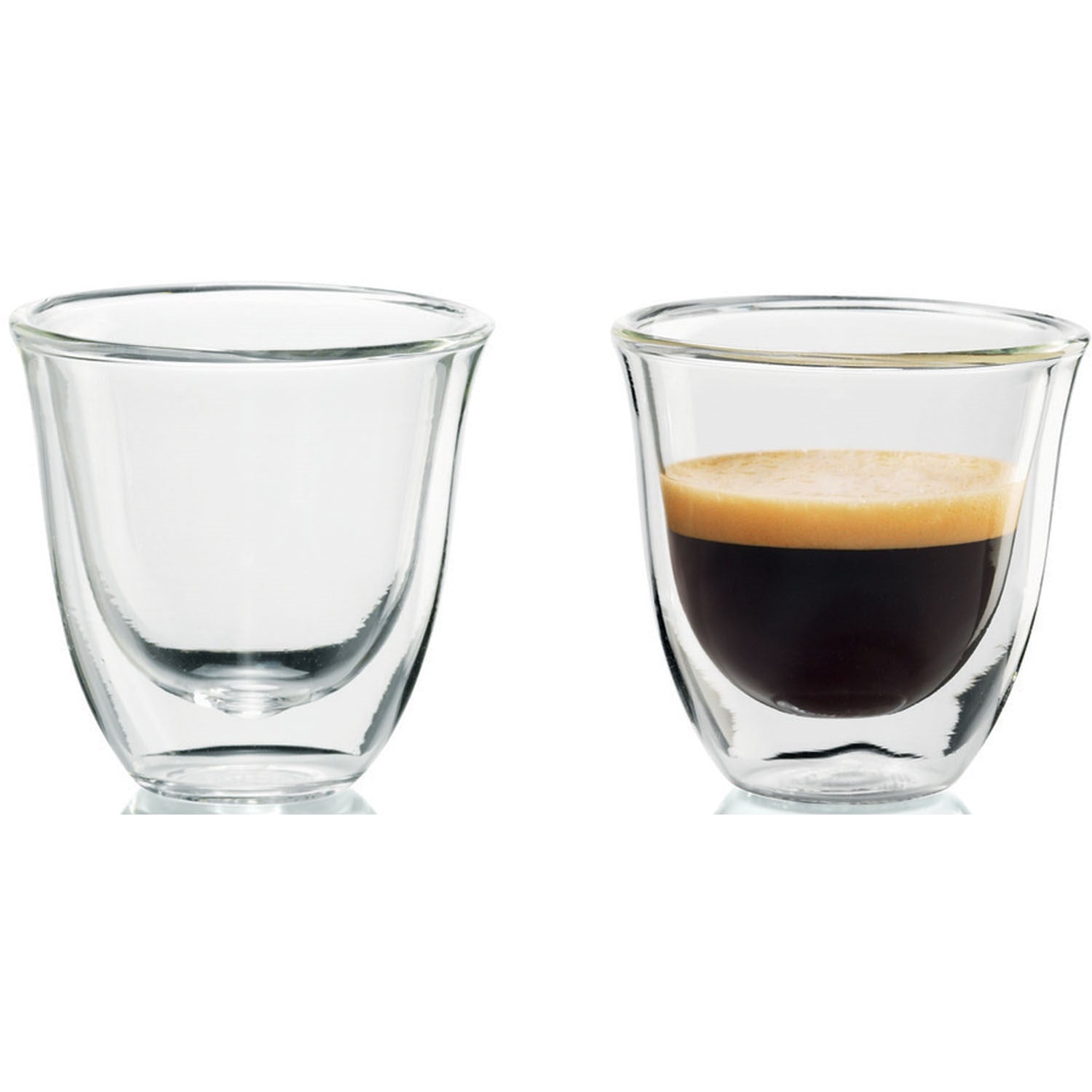Two clear espresso glasses, one filled with espresso and crema