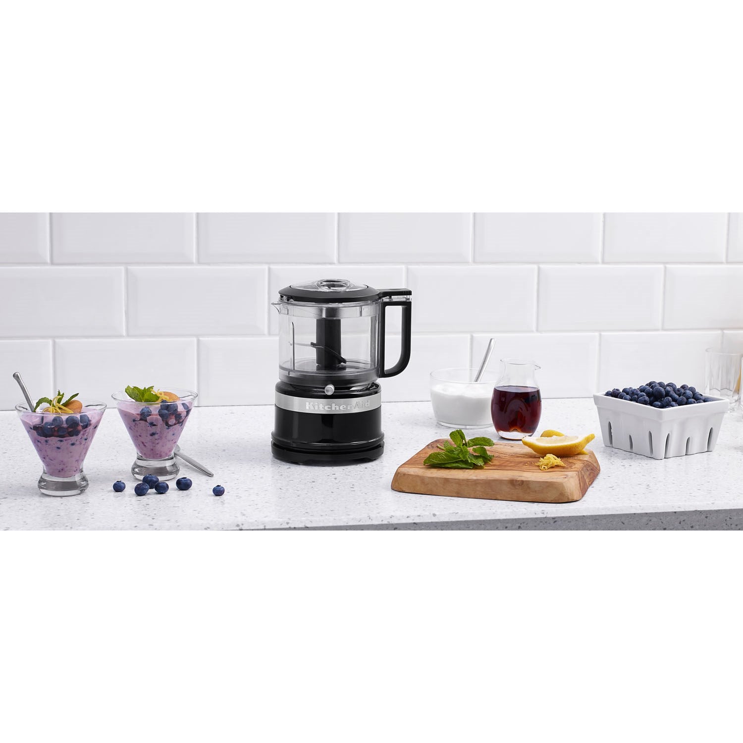 KitchenAid food chopper with clear bowl, black base, and side handle in Onyx Black
