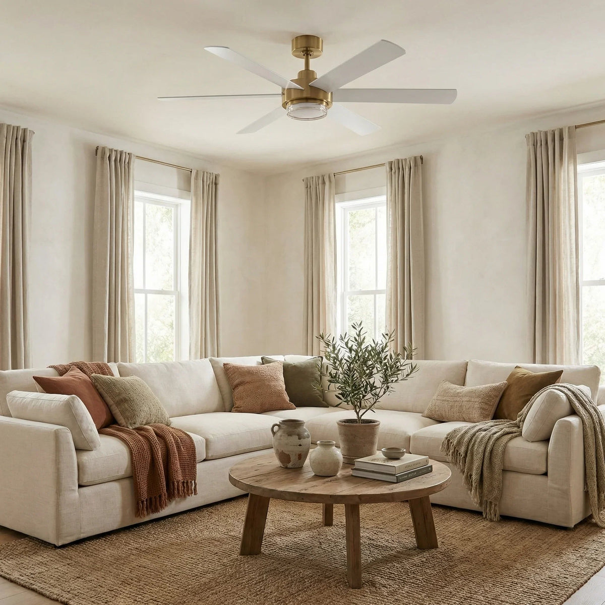 Golden modern 54-inch ceiling fan with LED light mounted on the ceiling