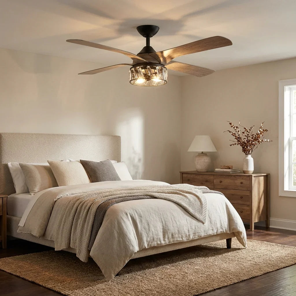 Black and wood-grain ceiling fan with glowing light fixture above bedroom